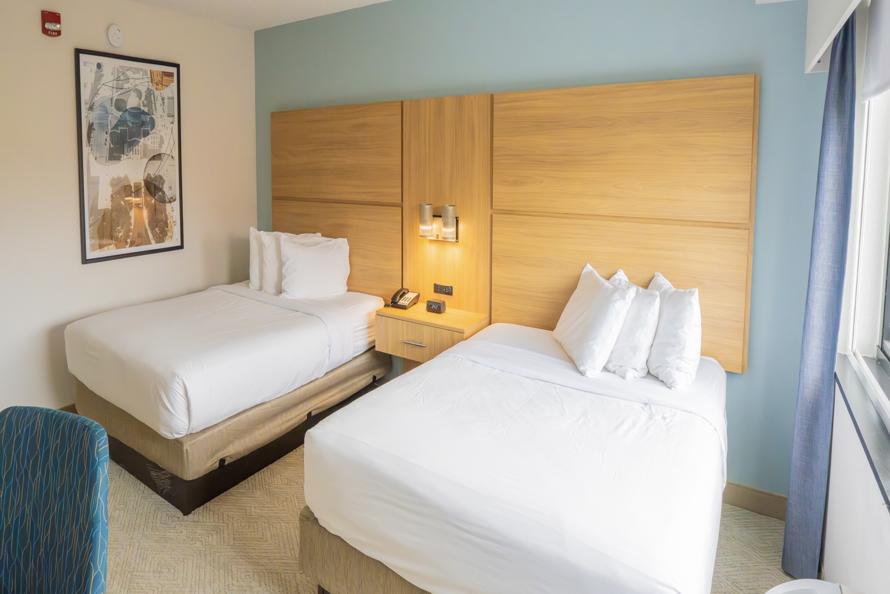 Guest room at the Elimwood Hotel, a Ramada by Wyndham in Maryland Heights, Missouri