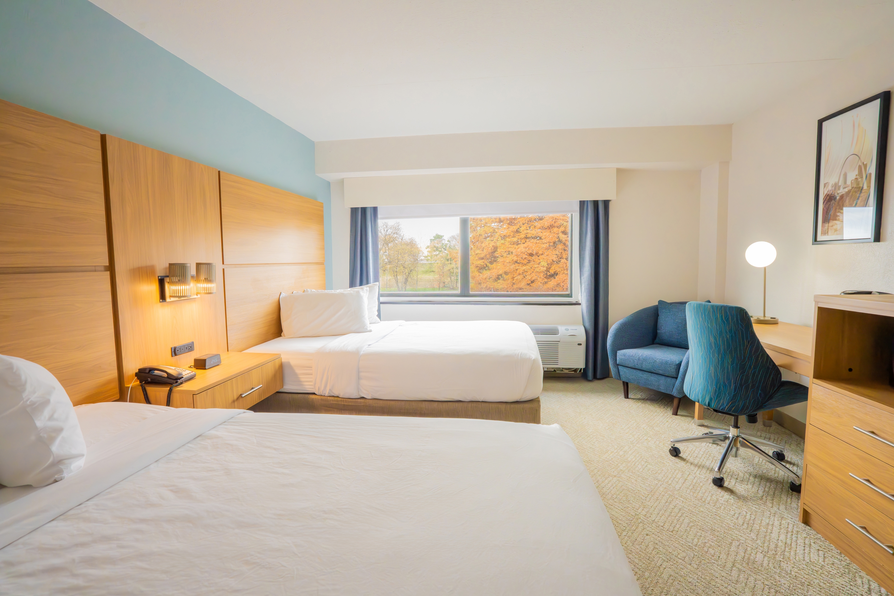 Guest room at the Elimwood Hotel, a Ramada by Wyndham in Maryland Heights, Missouri
