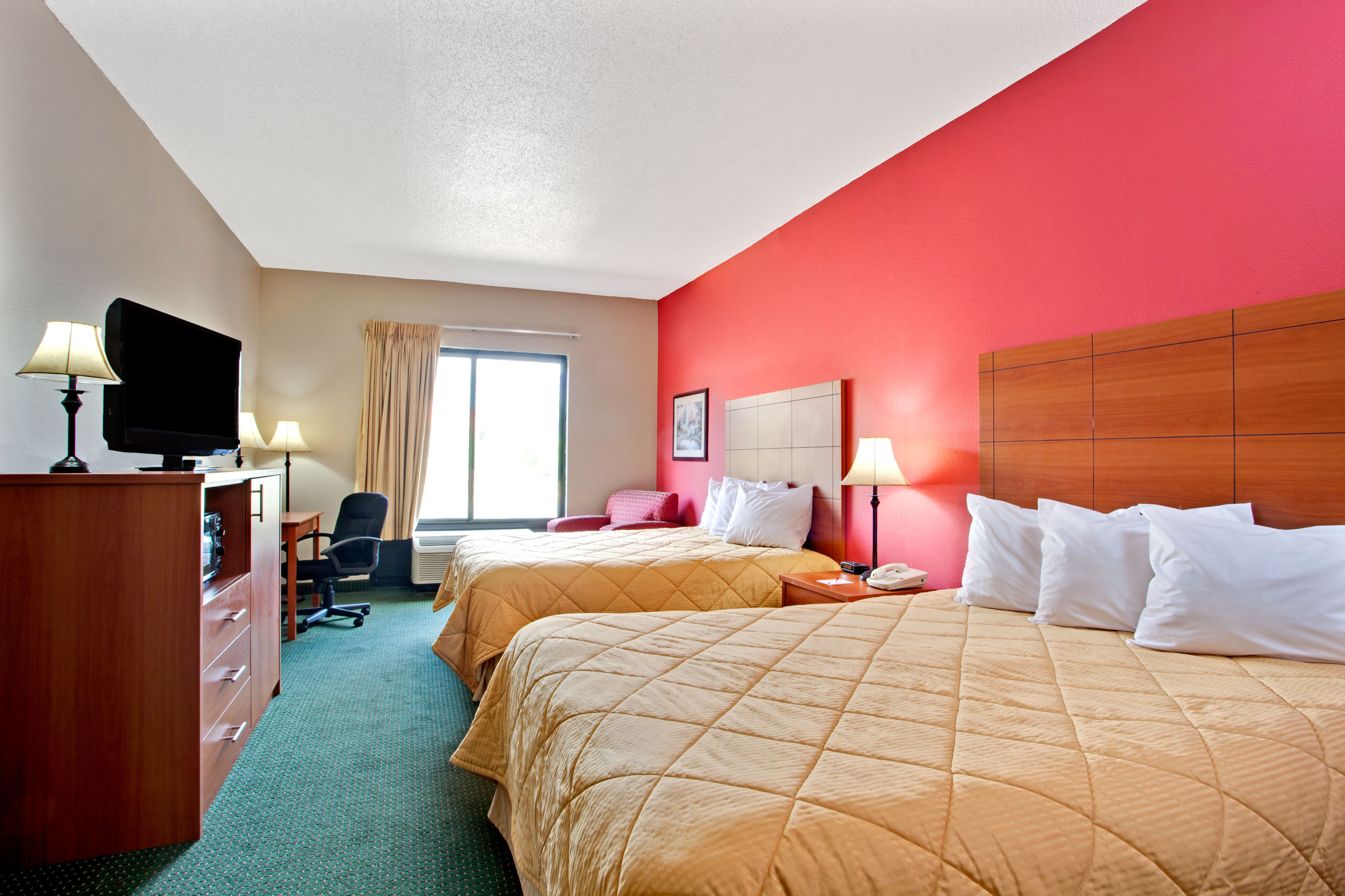Guest room at the Ramada by Wyndham Pearl/Jackson Airport in Pearl, Mississippi