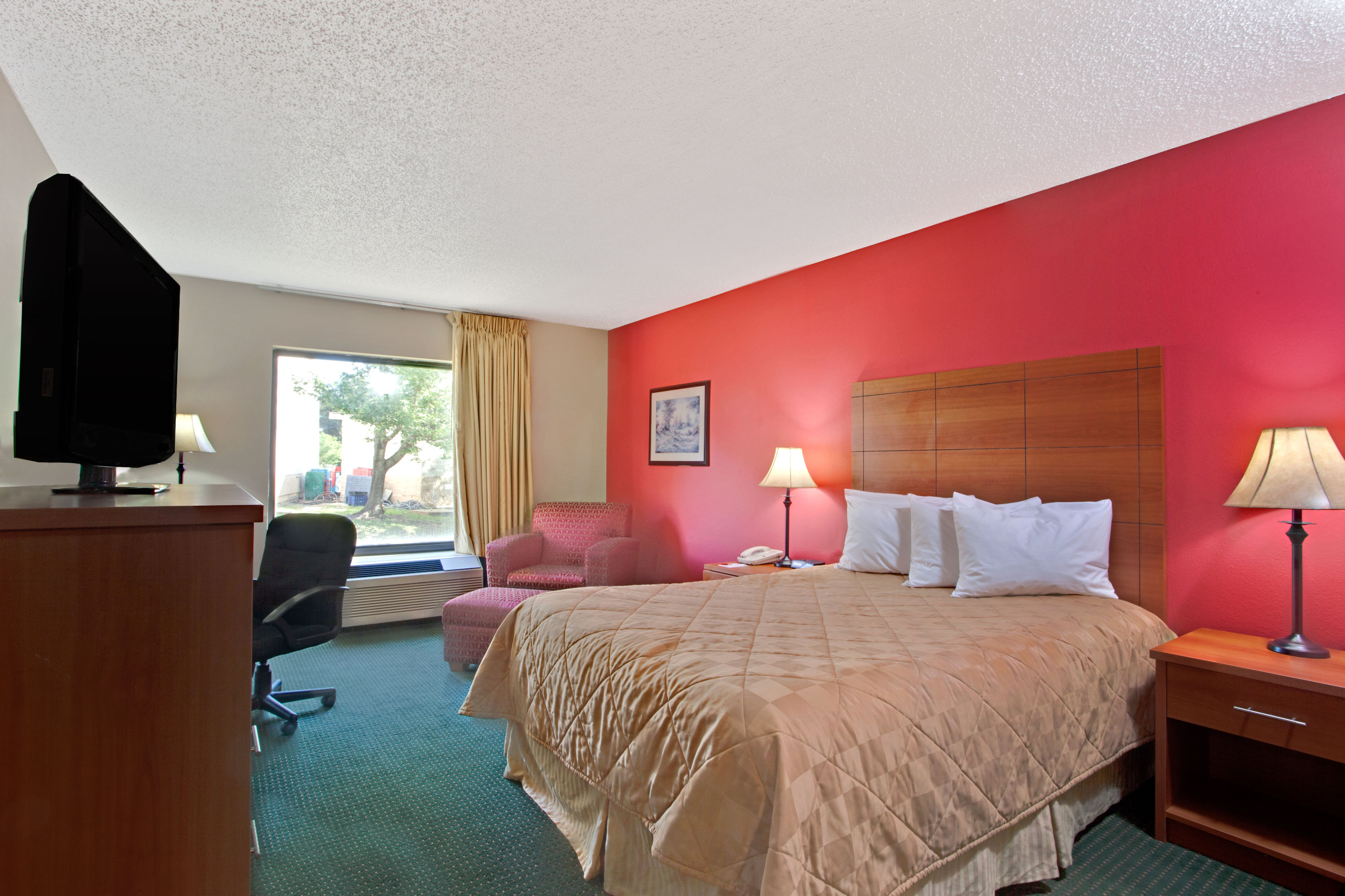 Guest room at the Ramada by Wyndham Pearl/Jackson Airport in Pearl, Mississippi