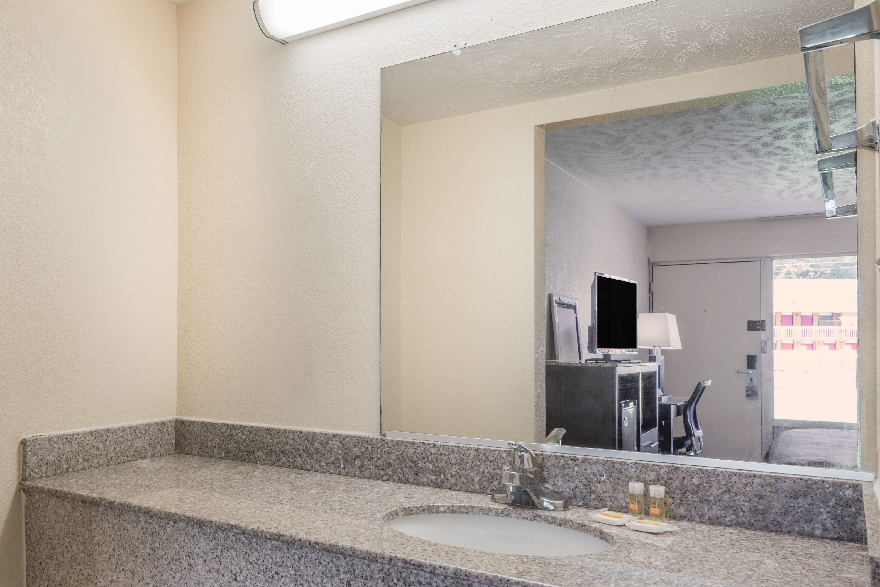Guest room bath at the Ramada by Wyndham Lumberton in Lumberton, North Carolina