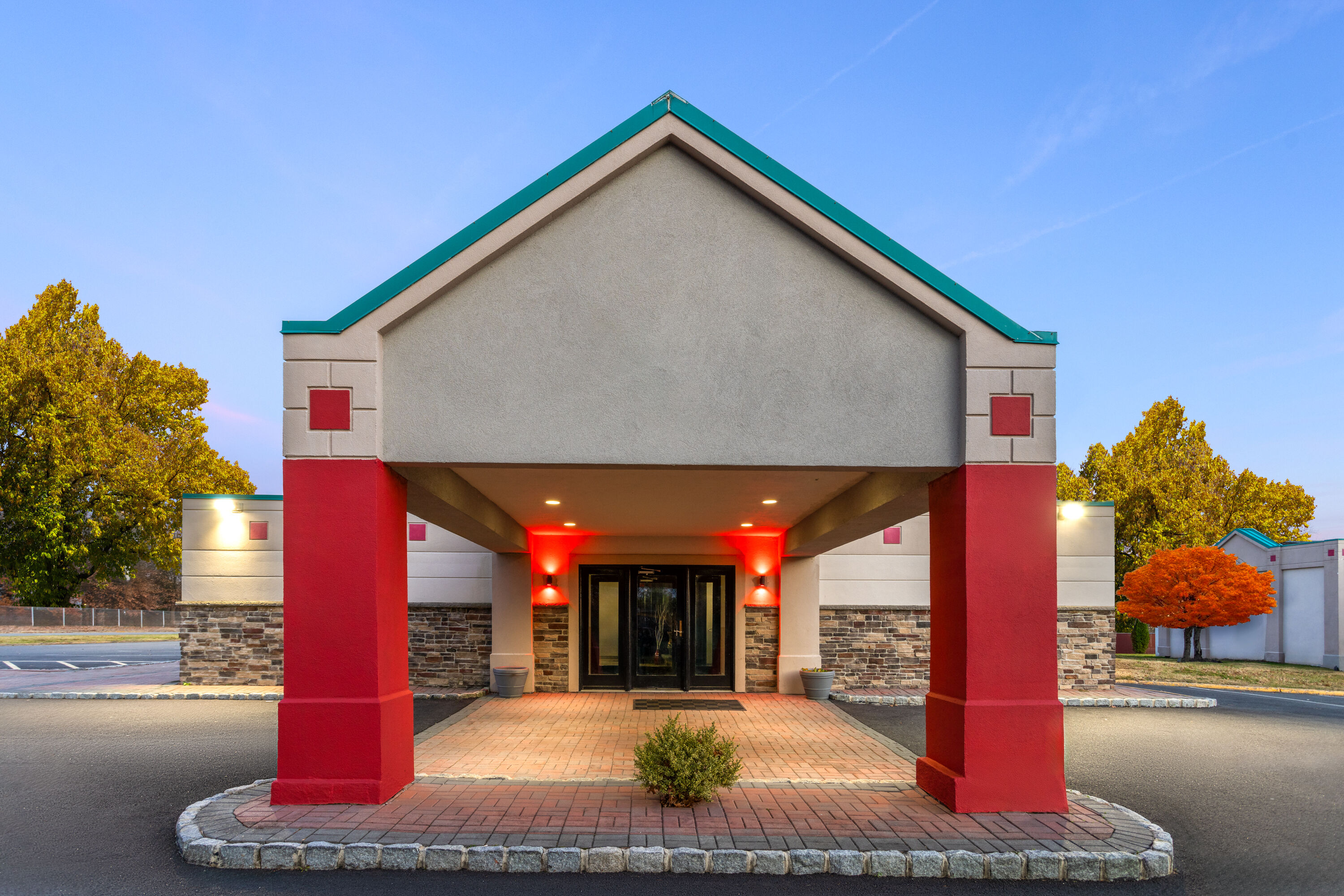 Exterior Dusk Image of Ramada by Wyndham Parsippany hotel in Parsippany, New Jersey