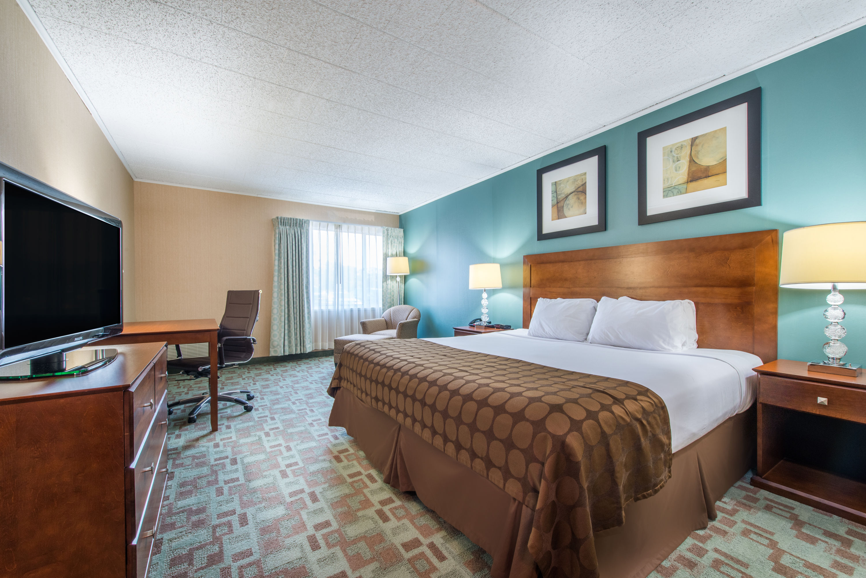 Guest room at the Ramada by Wyndham Vineland Millville Area in Vineland, New Jersey