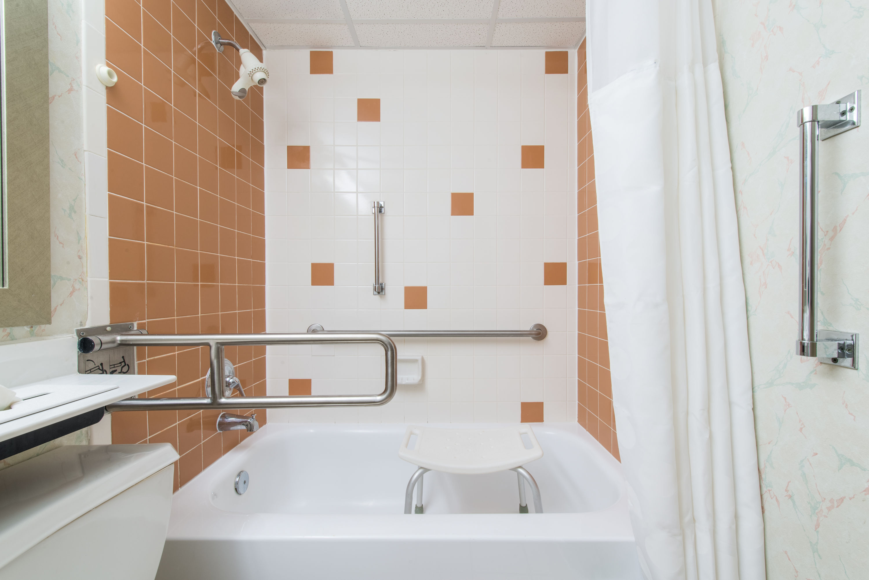 Guest room bath at the Ramada by Wyndham Vineland Millville Area in Vineland, New Jersey