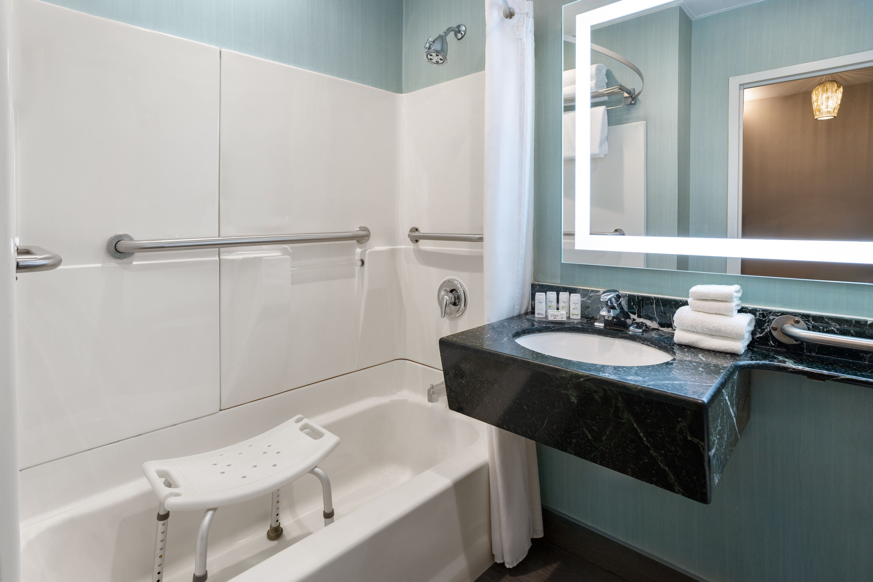Guest room bath at the Ramada by Wyndham Bronx in Bronx, New York