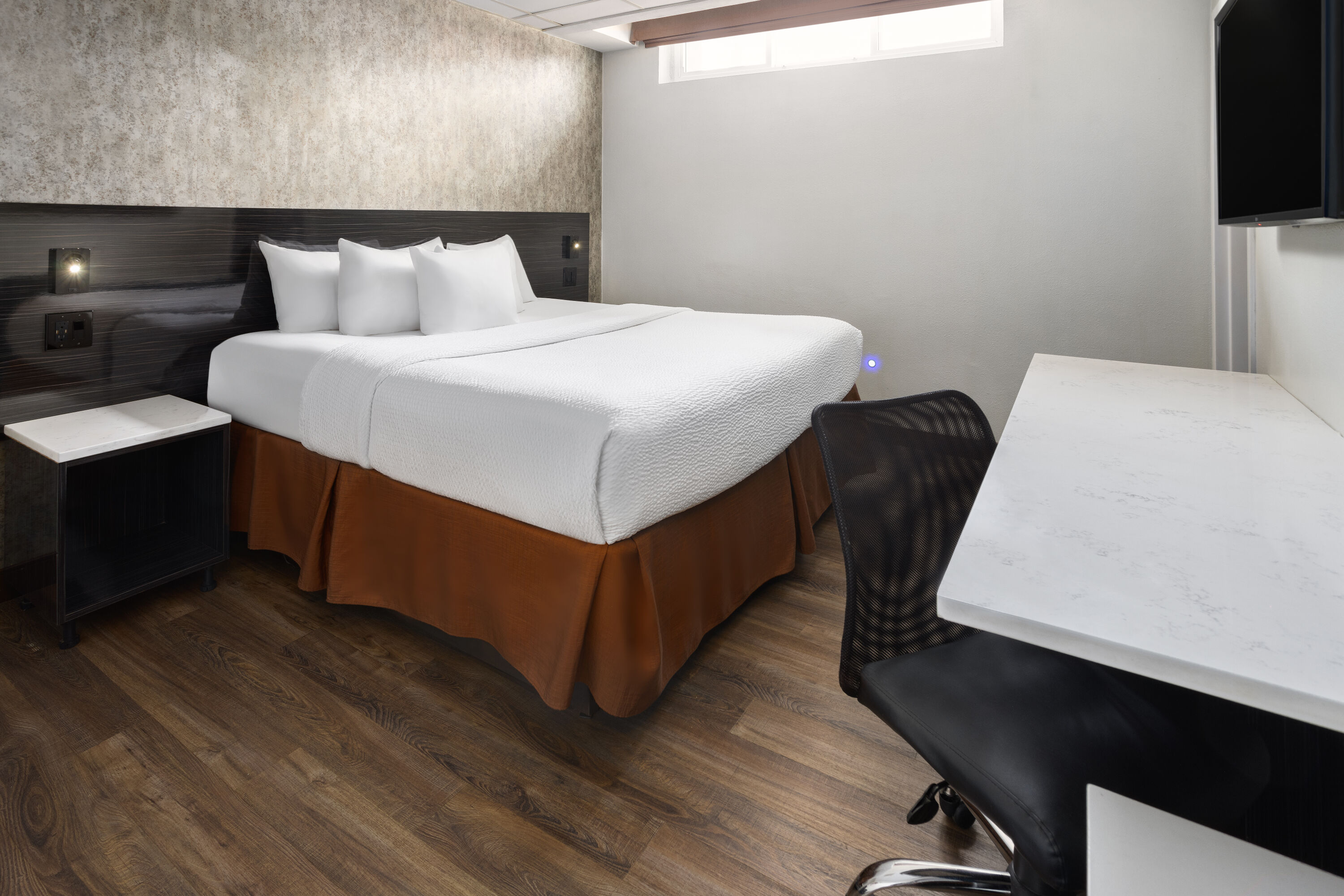 Guest room at the Ramada by Wyndham Bronx in Bronx, New York