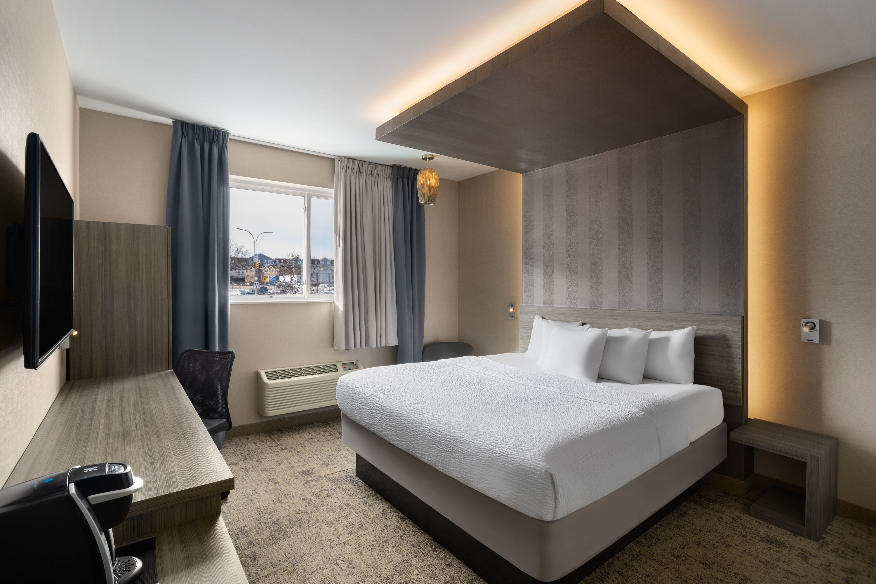 Guest room at the Ramada by Wyndham Bronx in Bronx, New York