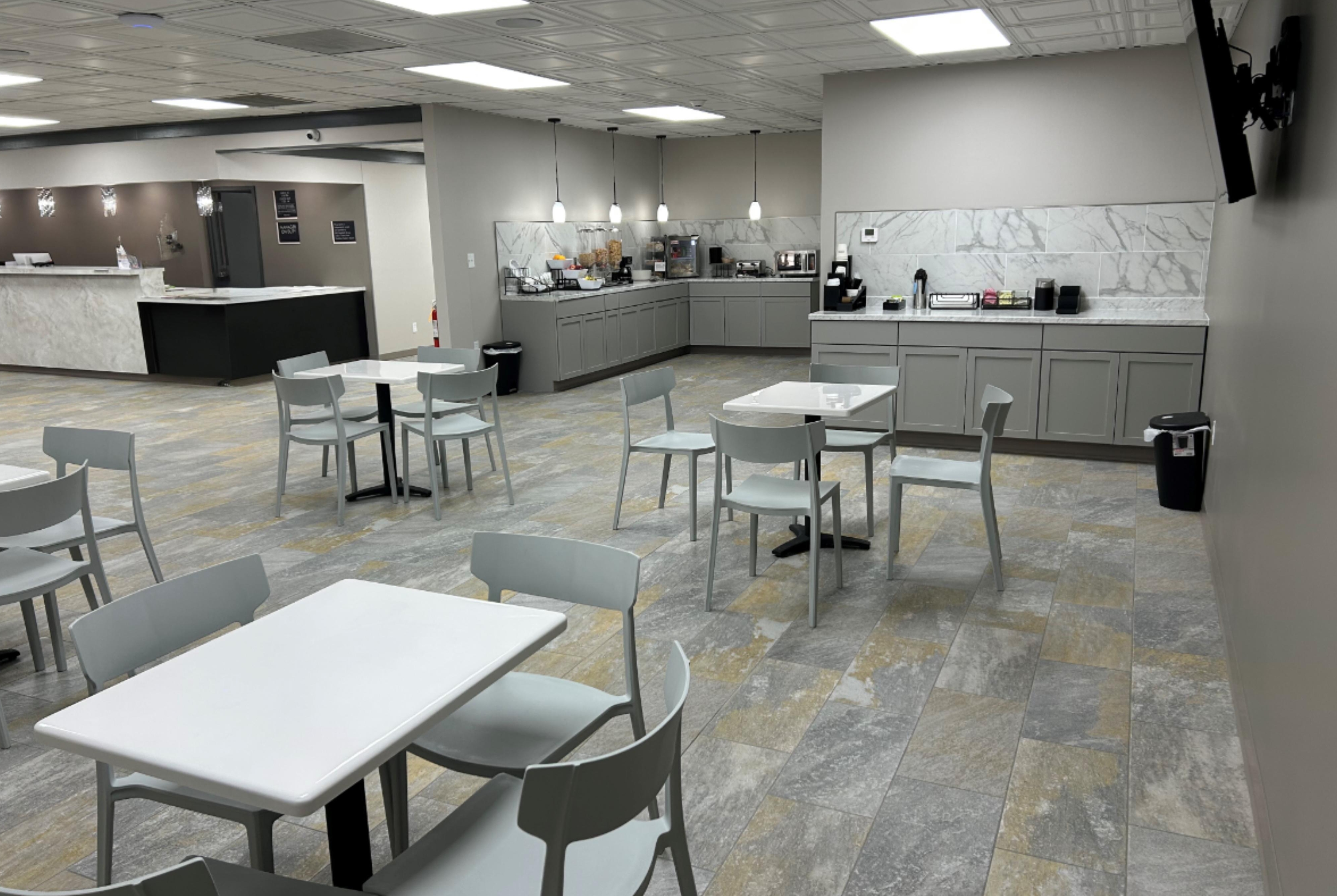 Ramada by Wyndham Cobleskill restaurant breakfast area with seating in Cobleskill, New York