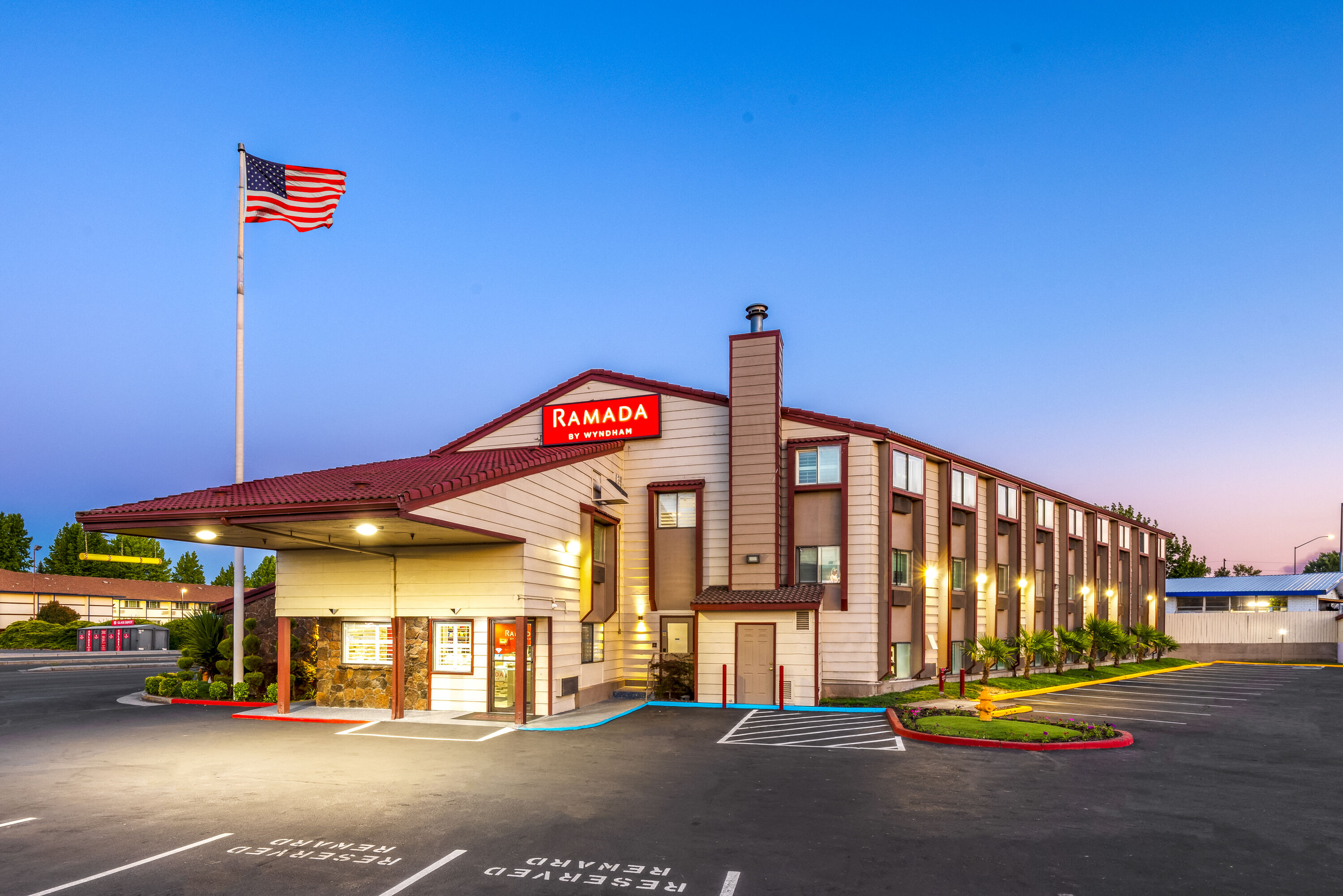 Exterior Dusk Image of Ramada by Wyndham Medford Airport North hotel in Medford, Oregon