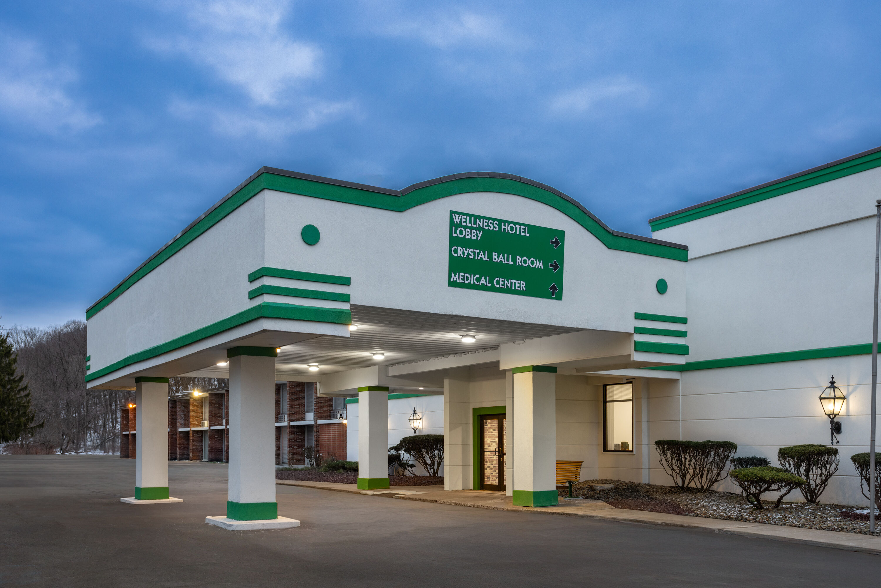 Exterior Dusk Image of Ramada by Wyndham Butler/Tesla Biohealing Resort hotel in Butler, Pennsylvania