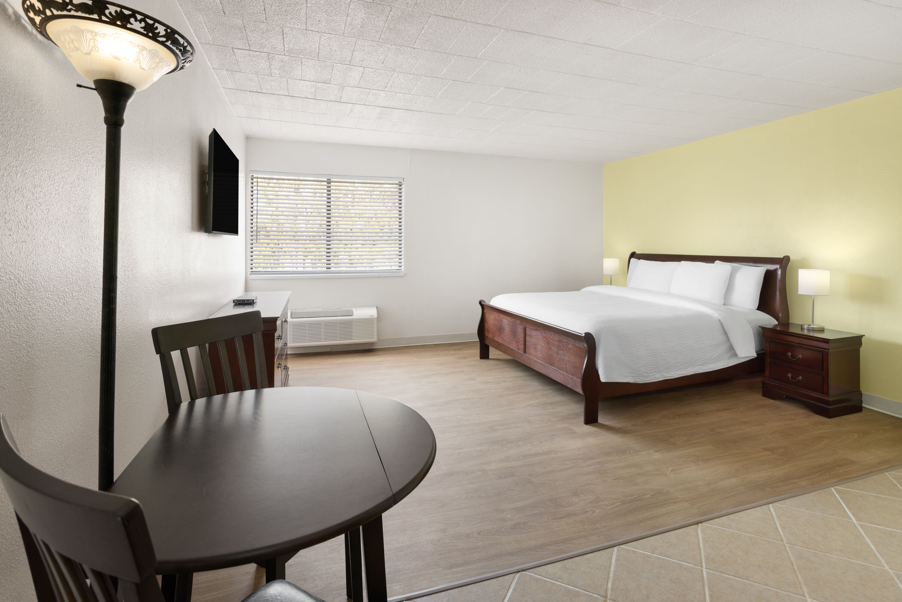 Guest room at the Ramada by Wyndham Butler/Tesla Biohealing Resort in Butler, Pennsylvania