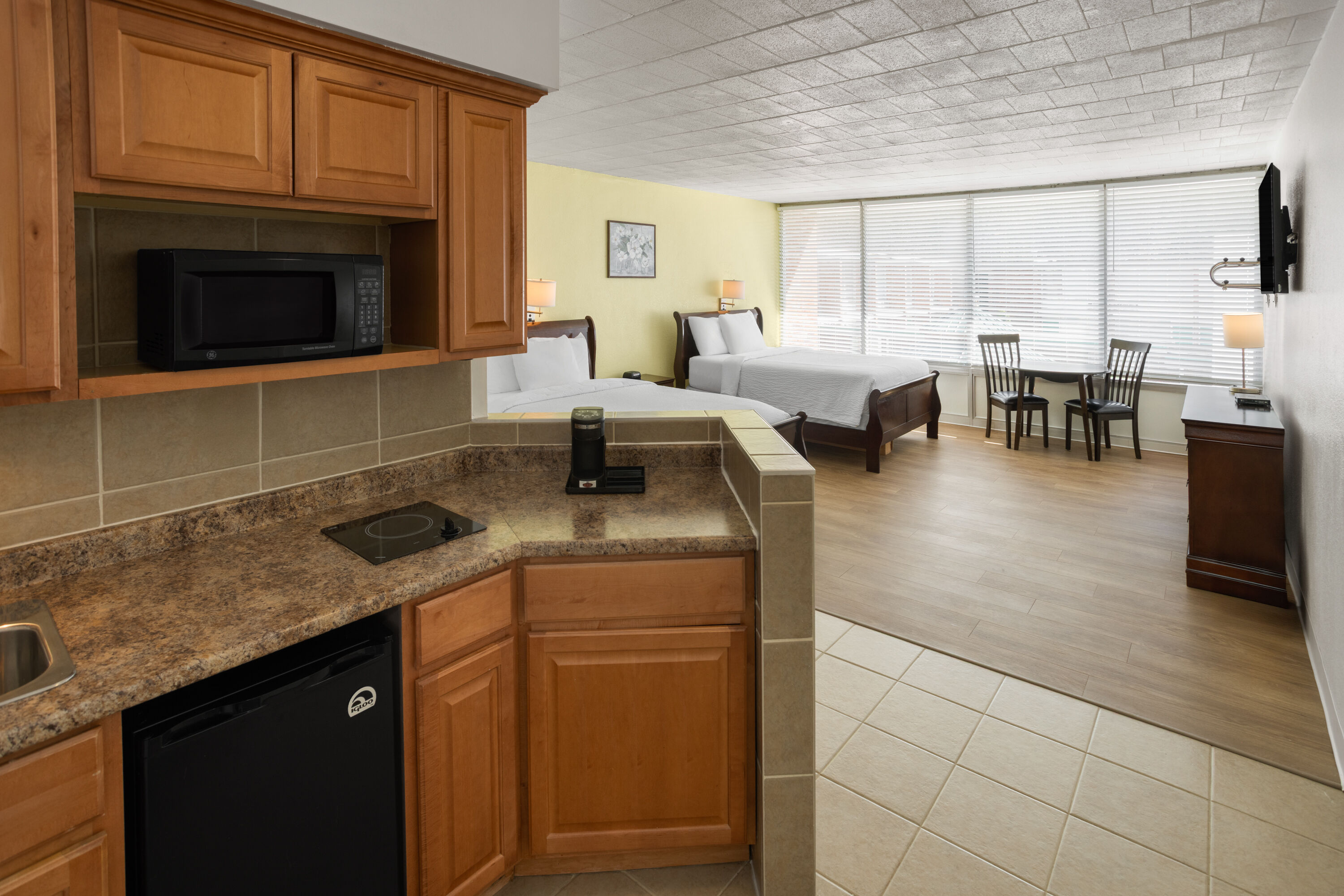 Guest room at the Ramada by Wyndham Butler/Tesla Biohealing Resort in Butler, Pennsylvania