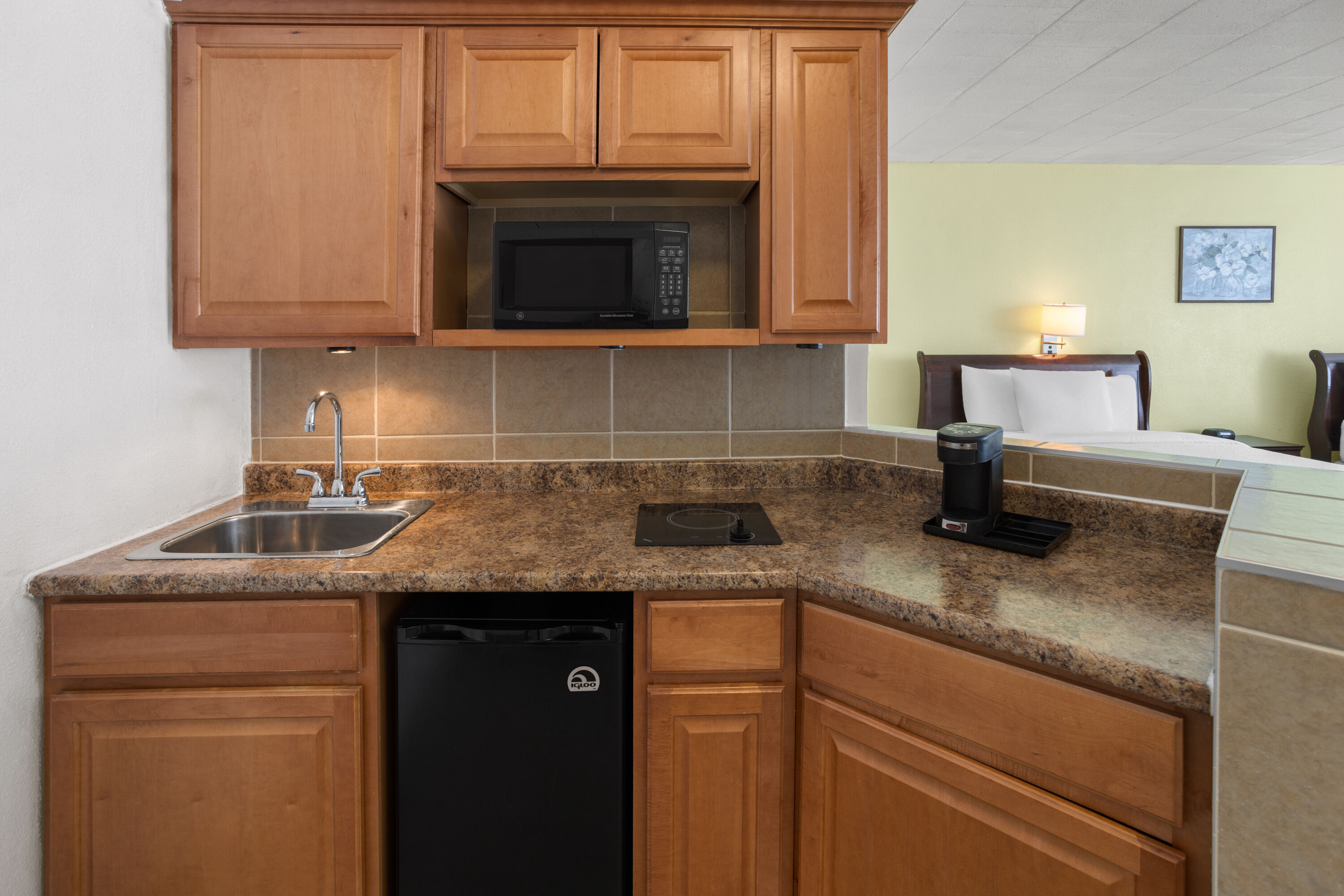 Guest room at the Ramada by Wyndham Butler/Tesla Biohealing Resort in Butler, Pennsylvania