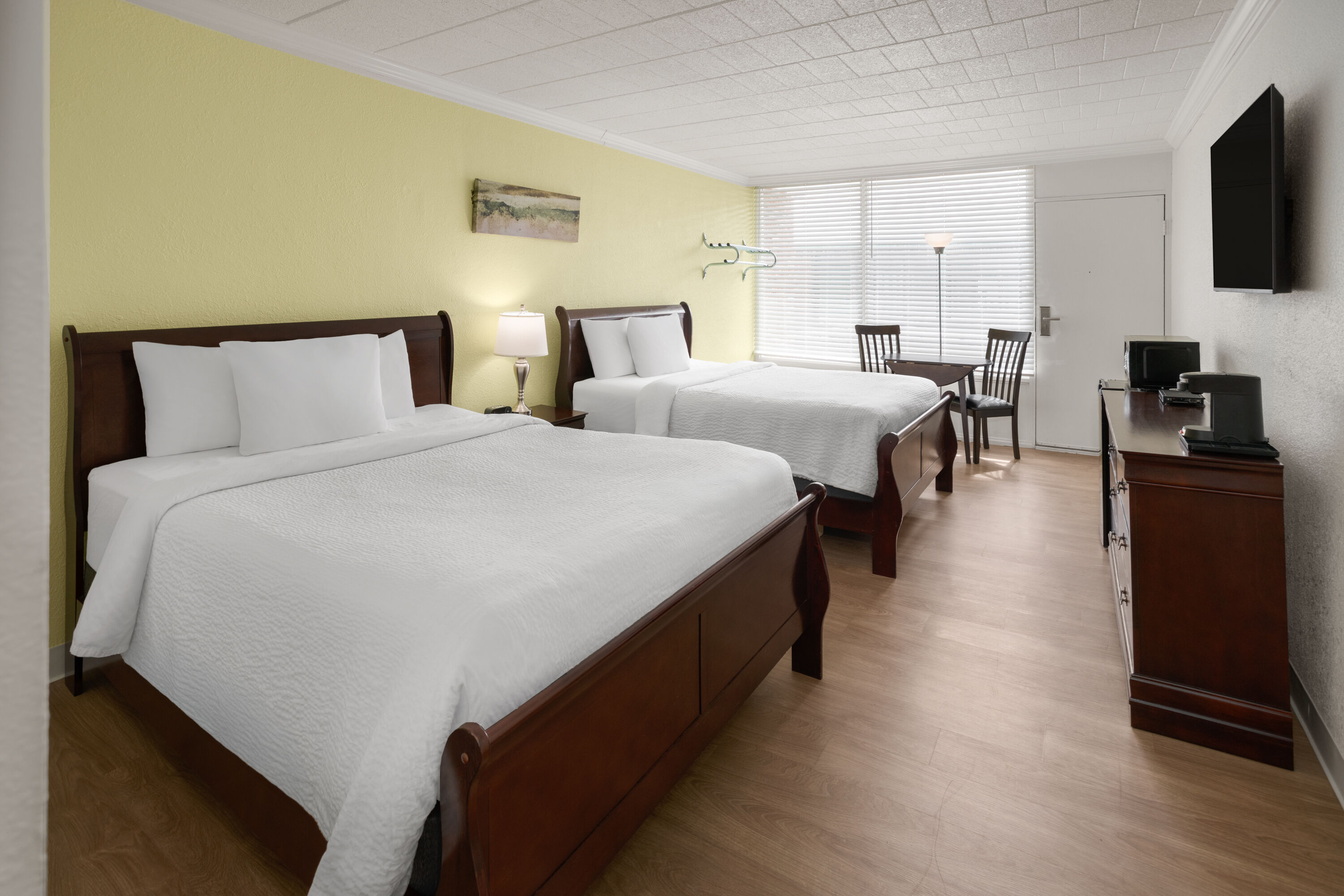 Guest room at the Ramada by Wyndham Butler/Tesla Biohealing Resort in Butler, Pennsylvania