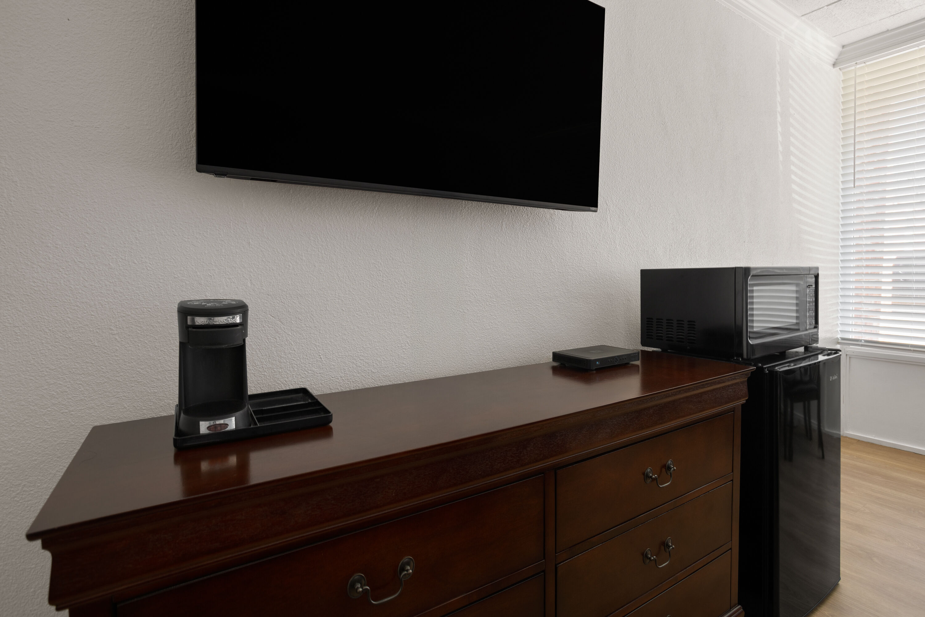 Guest room at the Ramada by Wyndham Butler/Tesla Biohealing Resort in Butler, Pennsylvania