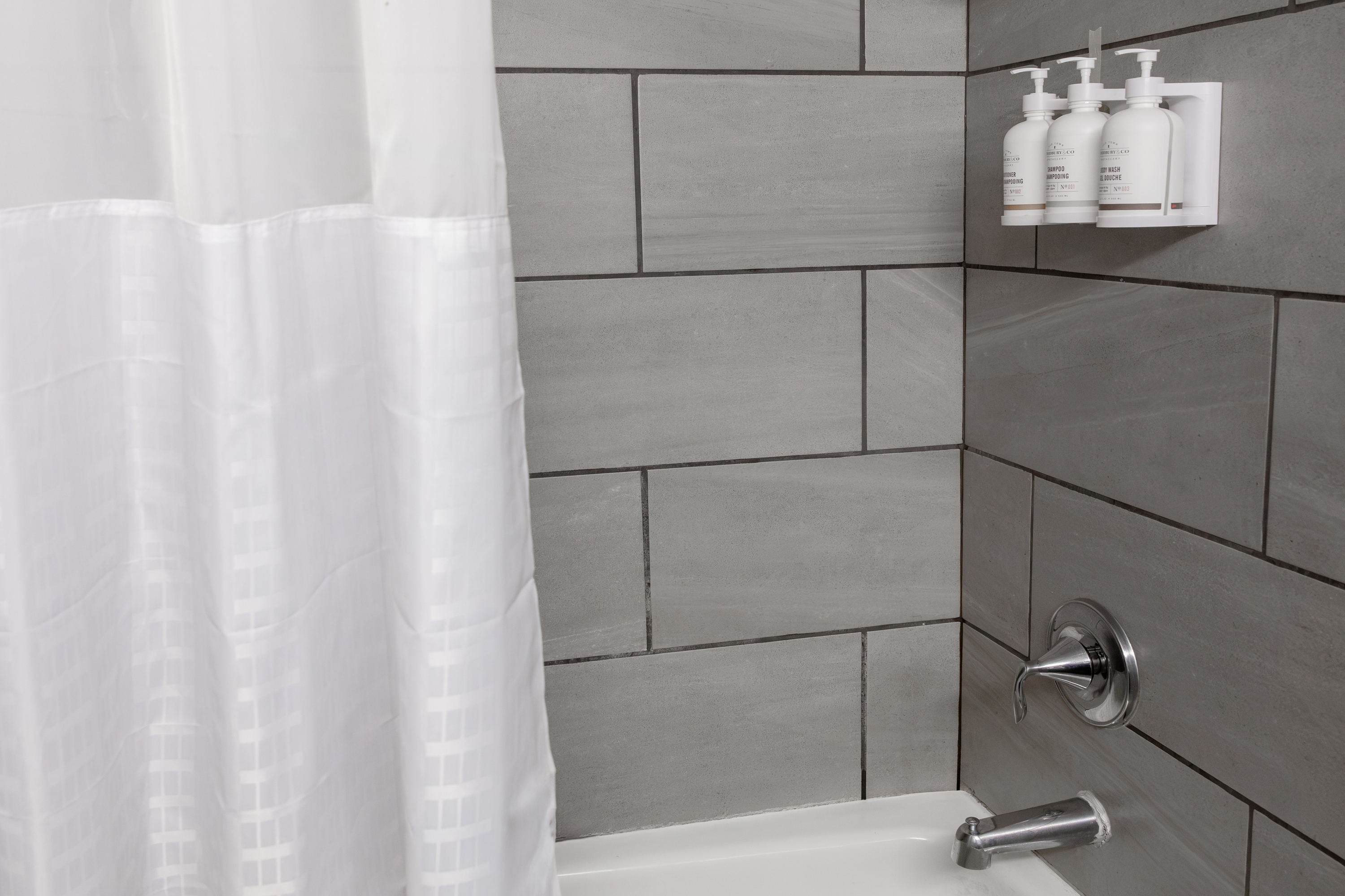 Guest room bath at the Ramada by Wyndham New Kensington in New Kensington, Pennsylvania