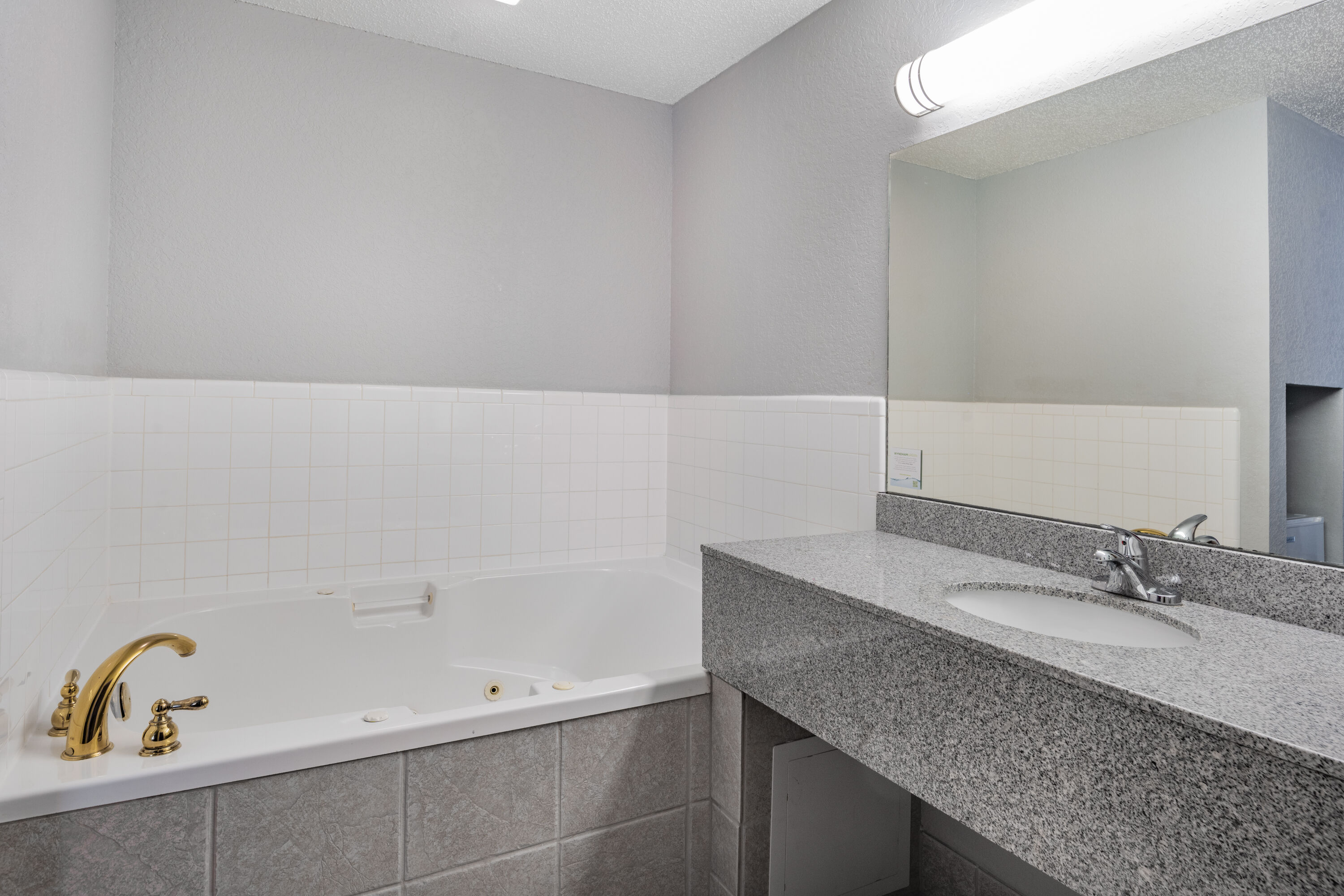 Guest room bath at the Ramada by Wyndham Keystone Near Mt Rushmore in Keystone, South Dakota