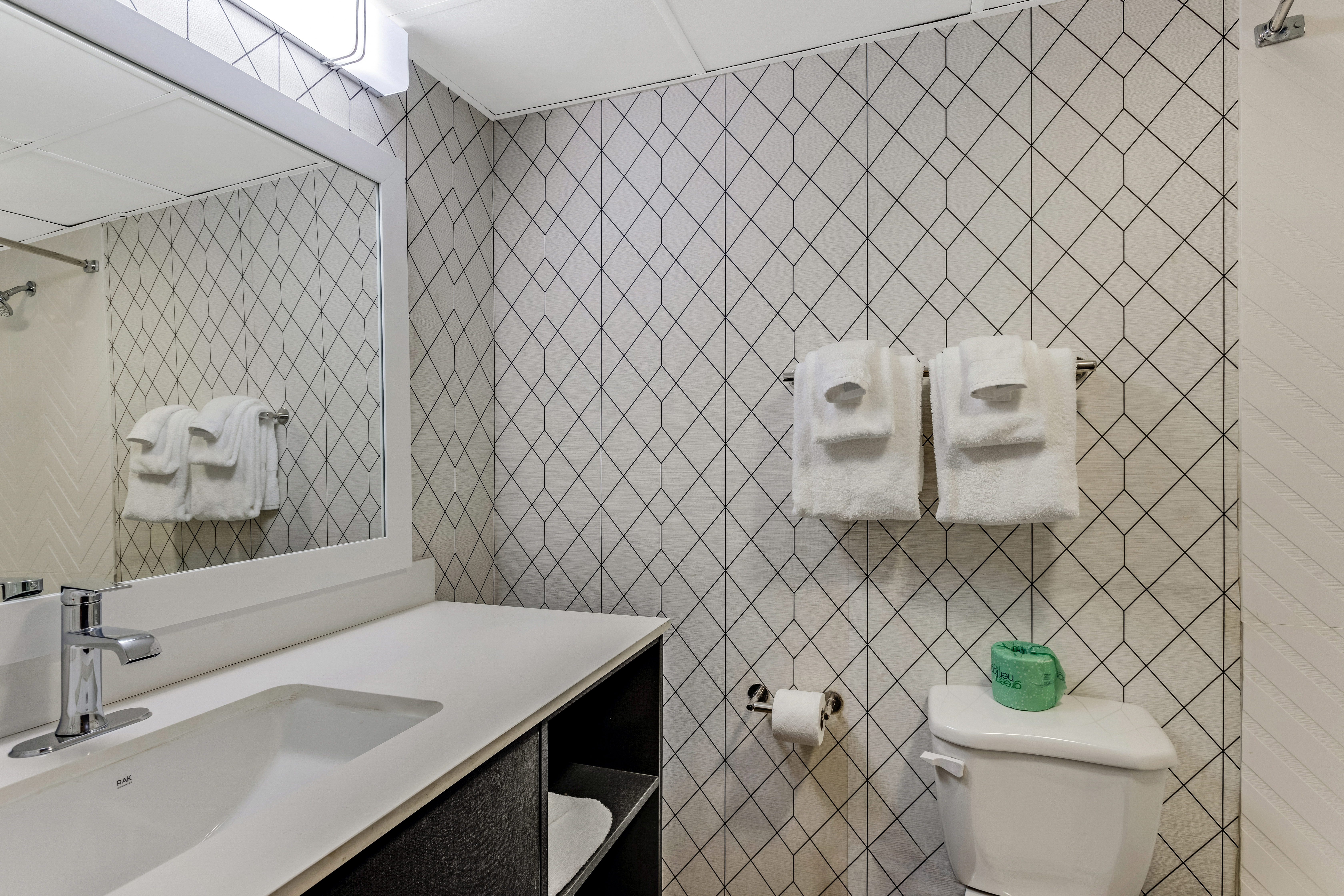 Guest room bath at the The Wander Hotel, a Ramada by Wyndham in Gatlinburg, Tennessee