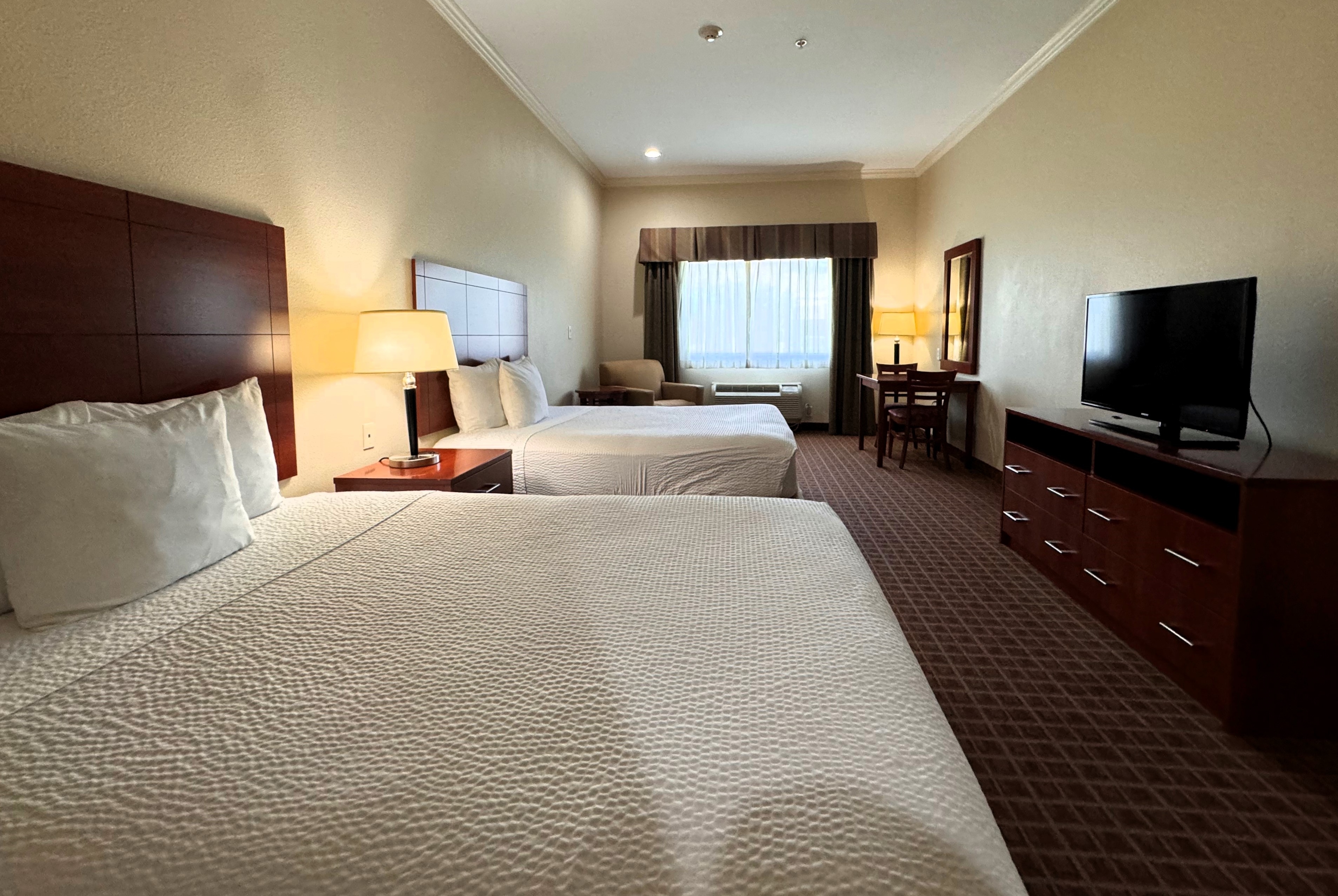 Guest room at the Ramada by Wyndham College Station in College Station, Texas