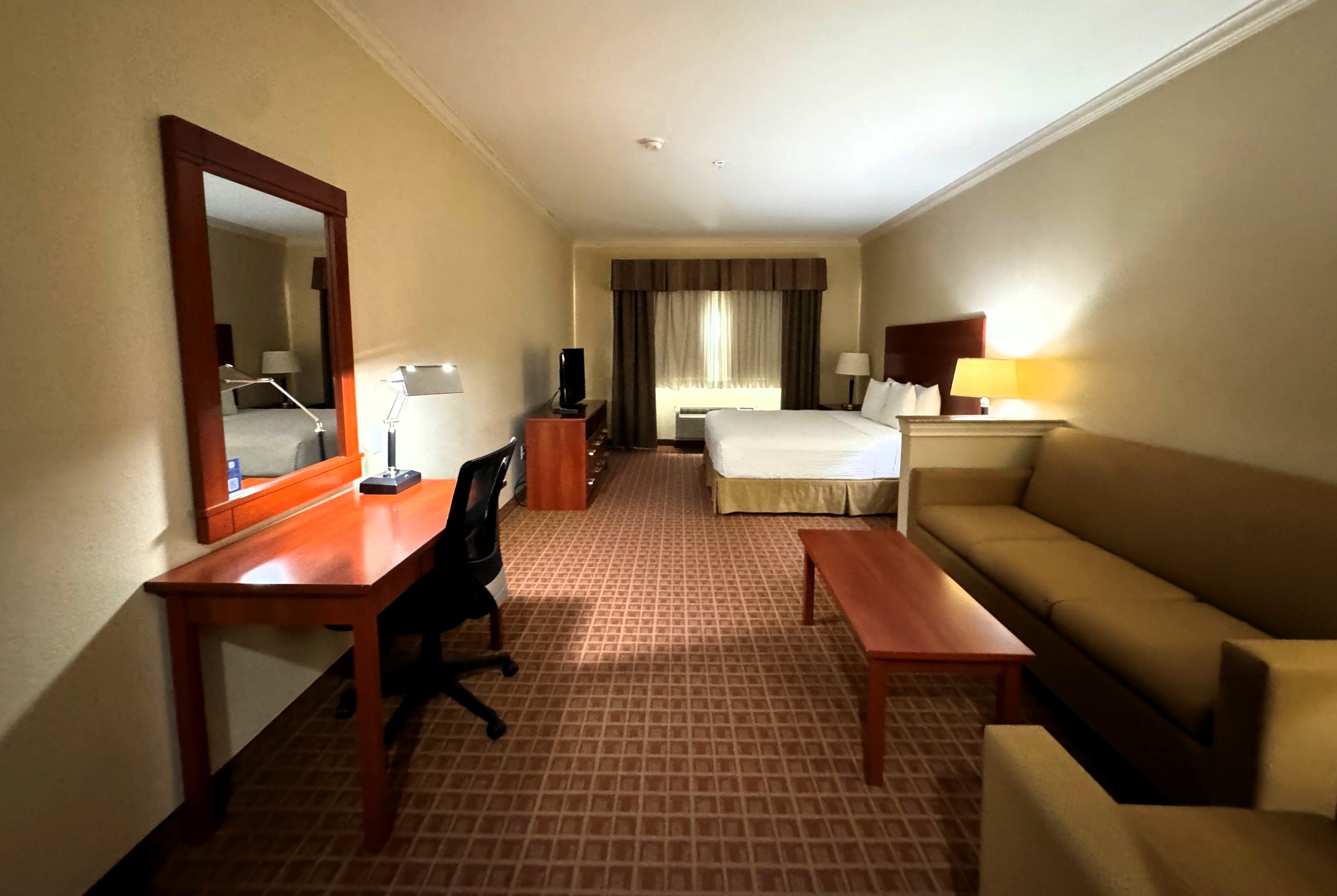 Guest room at the Ramada by Wyndham College Station in College Station, Texas