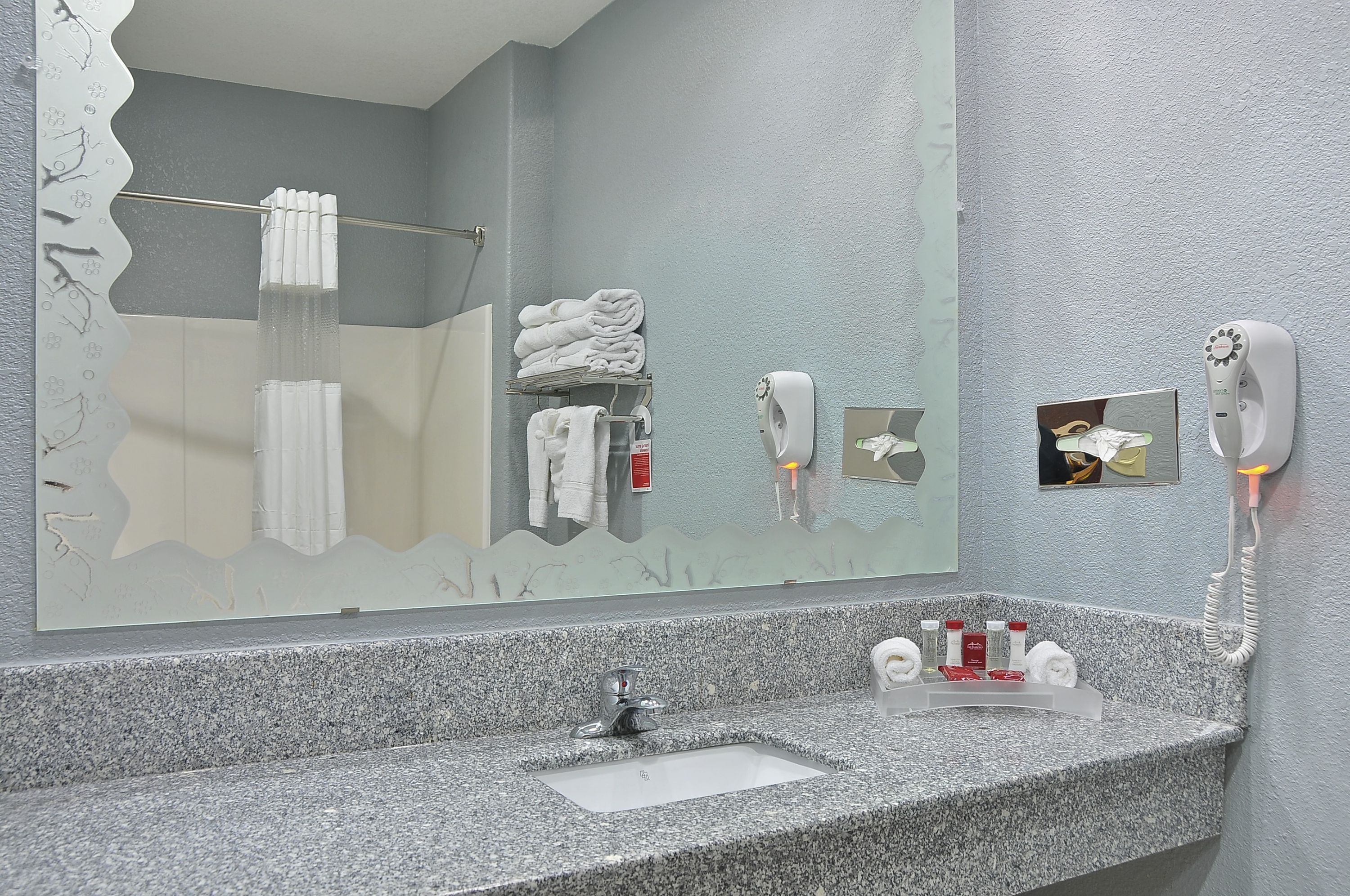 Guest room bath at the Ramada by Wyndham South Waco in Hewitt, Texas