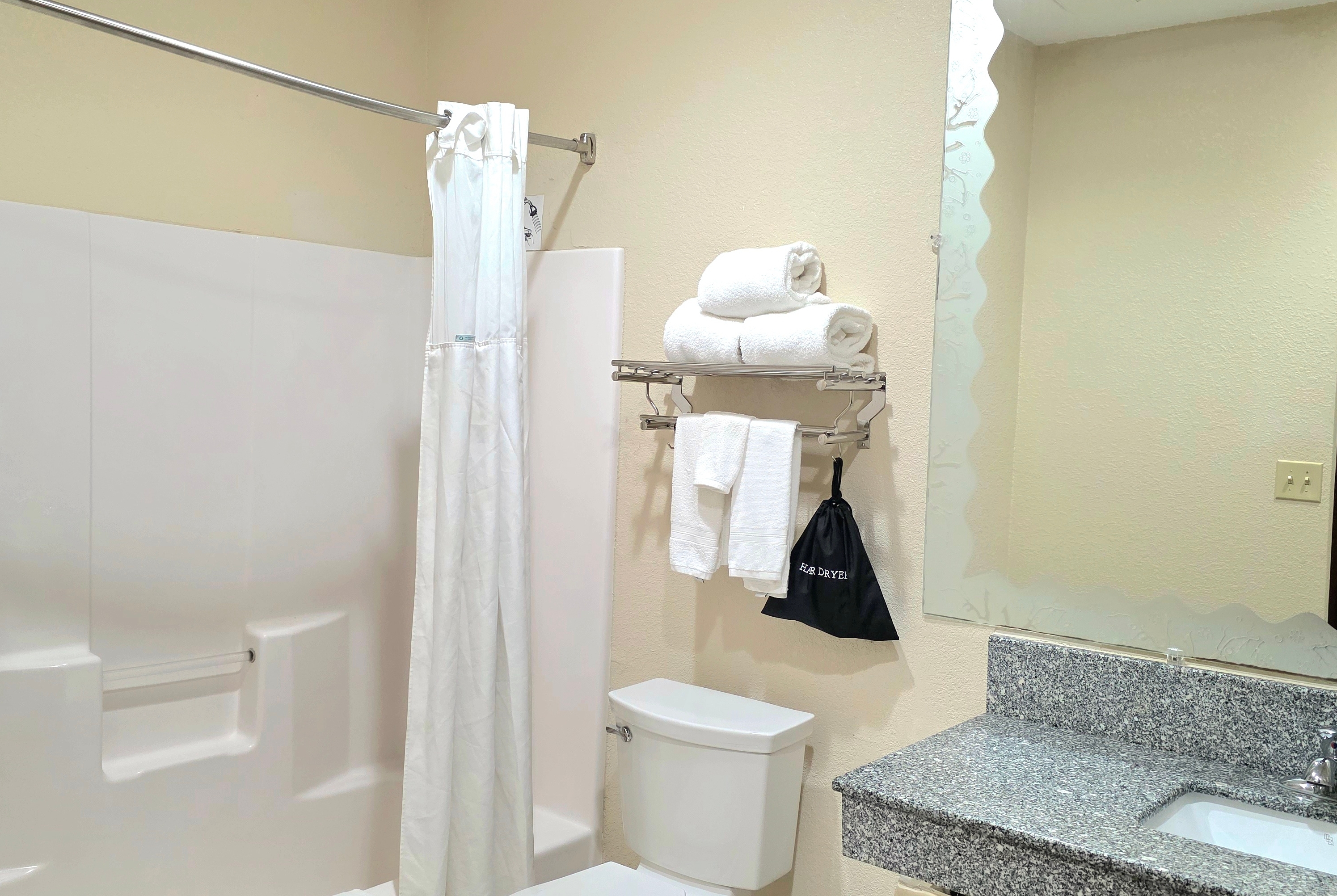 Guest room bath at the Ramada by Wyndham South Waco in Hewitt, Texas