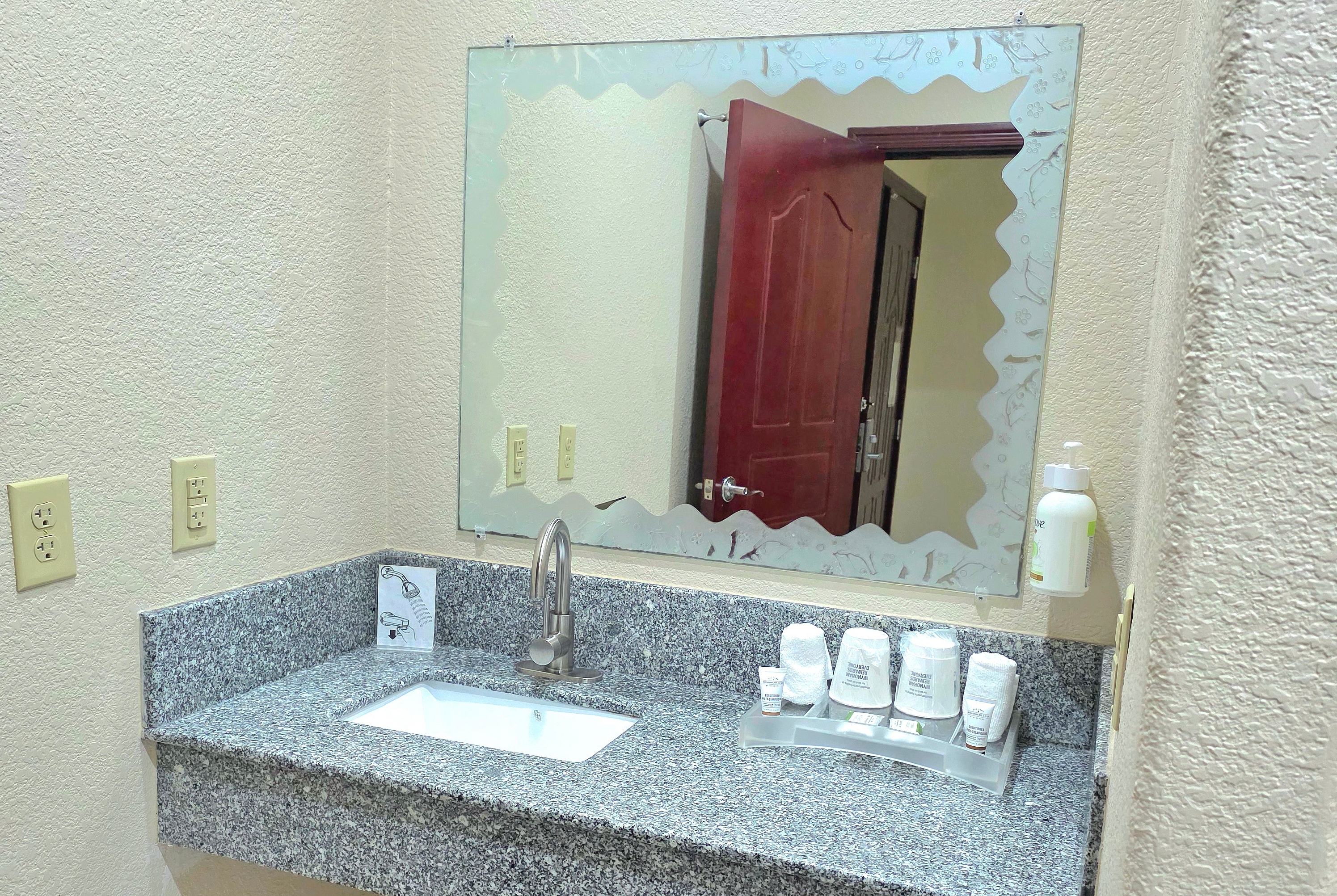 Guest room bath at the Ramada by Wyndham South Waco in Hewitt, Texas
