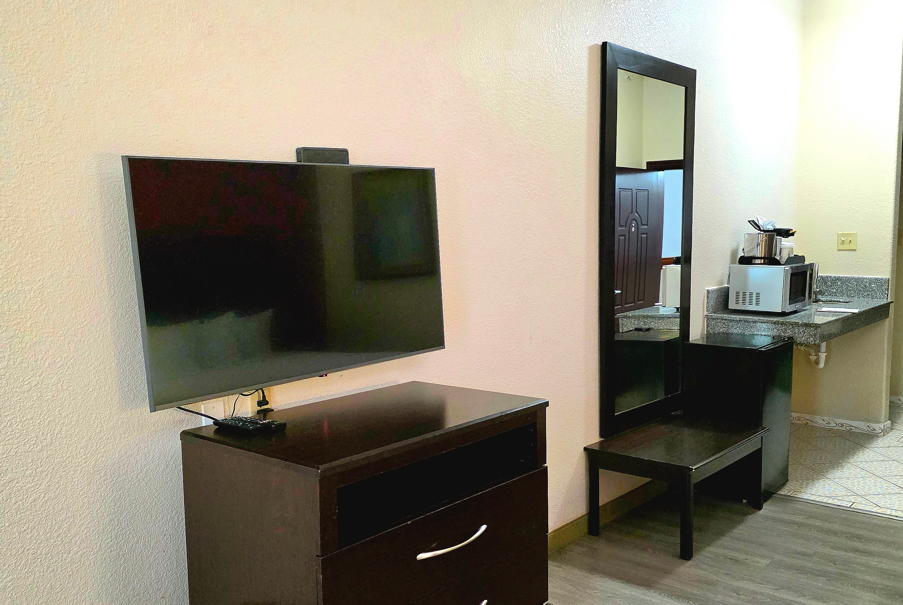 Guest room feature at the Ramada by Wyndham South Waco in Hewitt, Texas