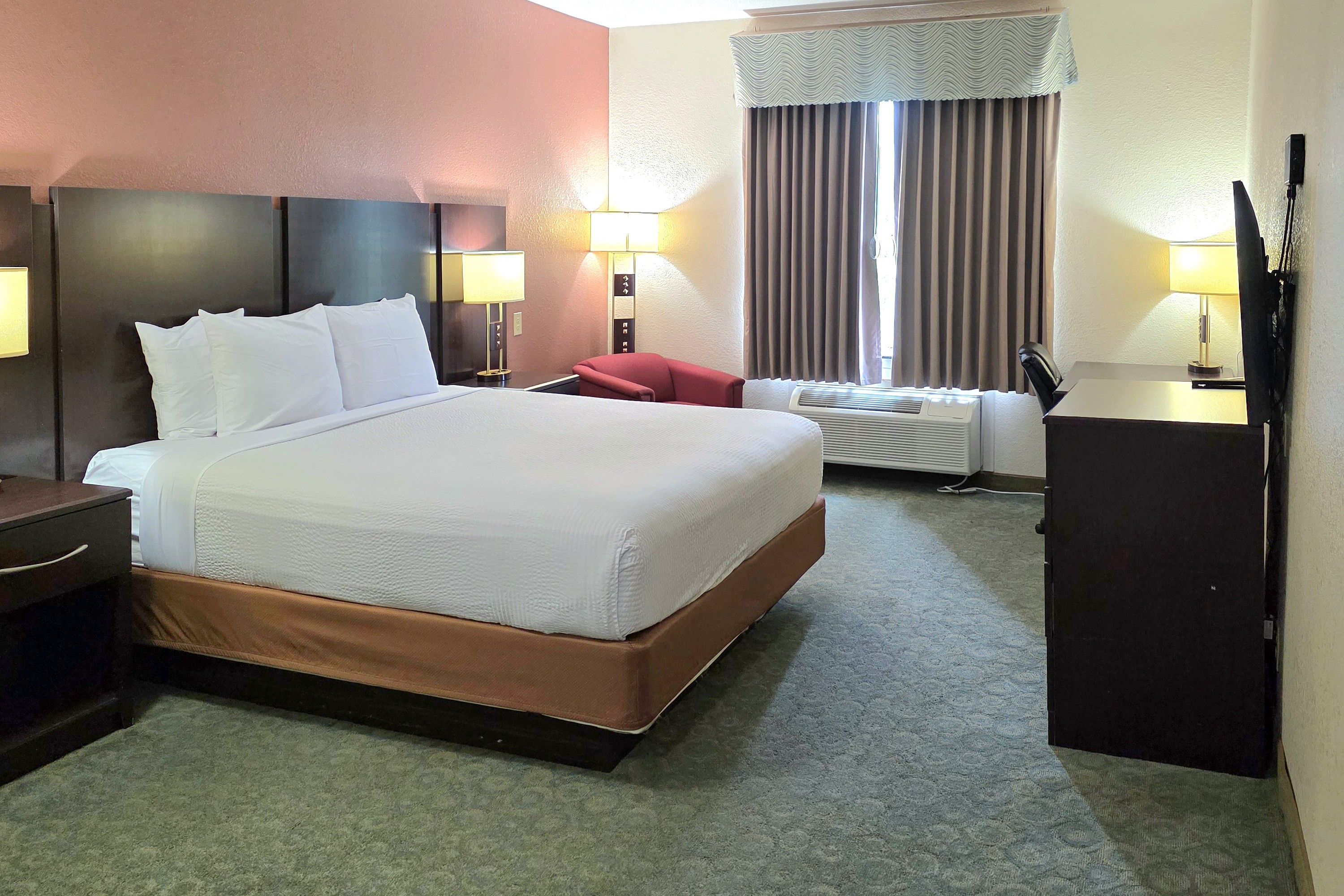 Guest room at the Ramada by Wyndham South Waco in Hewitt, Texas