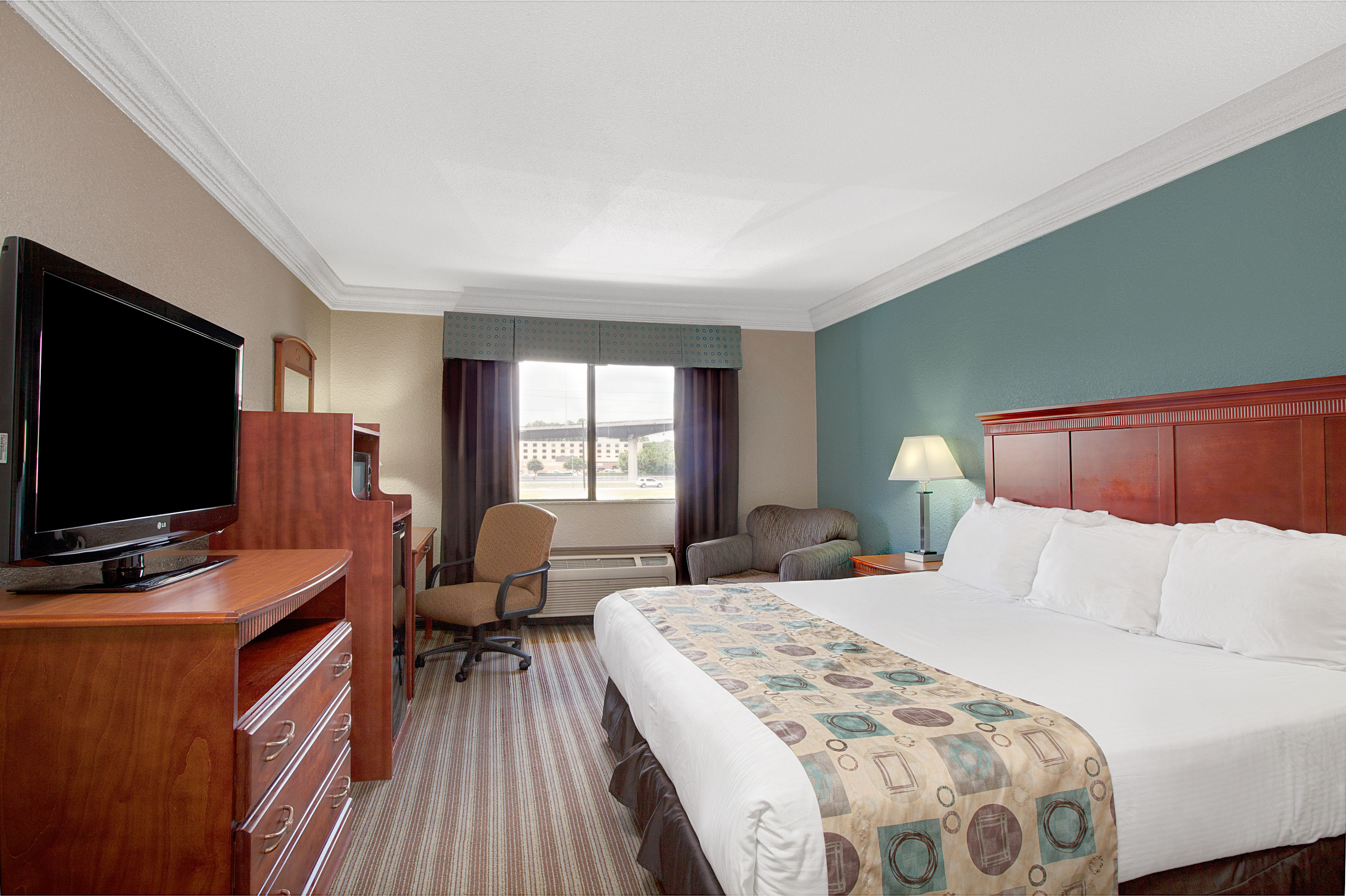 Guest room at the Ramada by Wyndham Houston Intercontinental Airport South in Houston, Texas