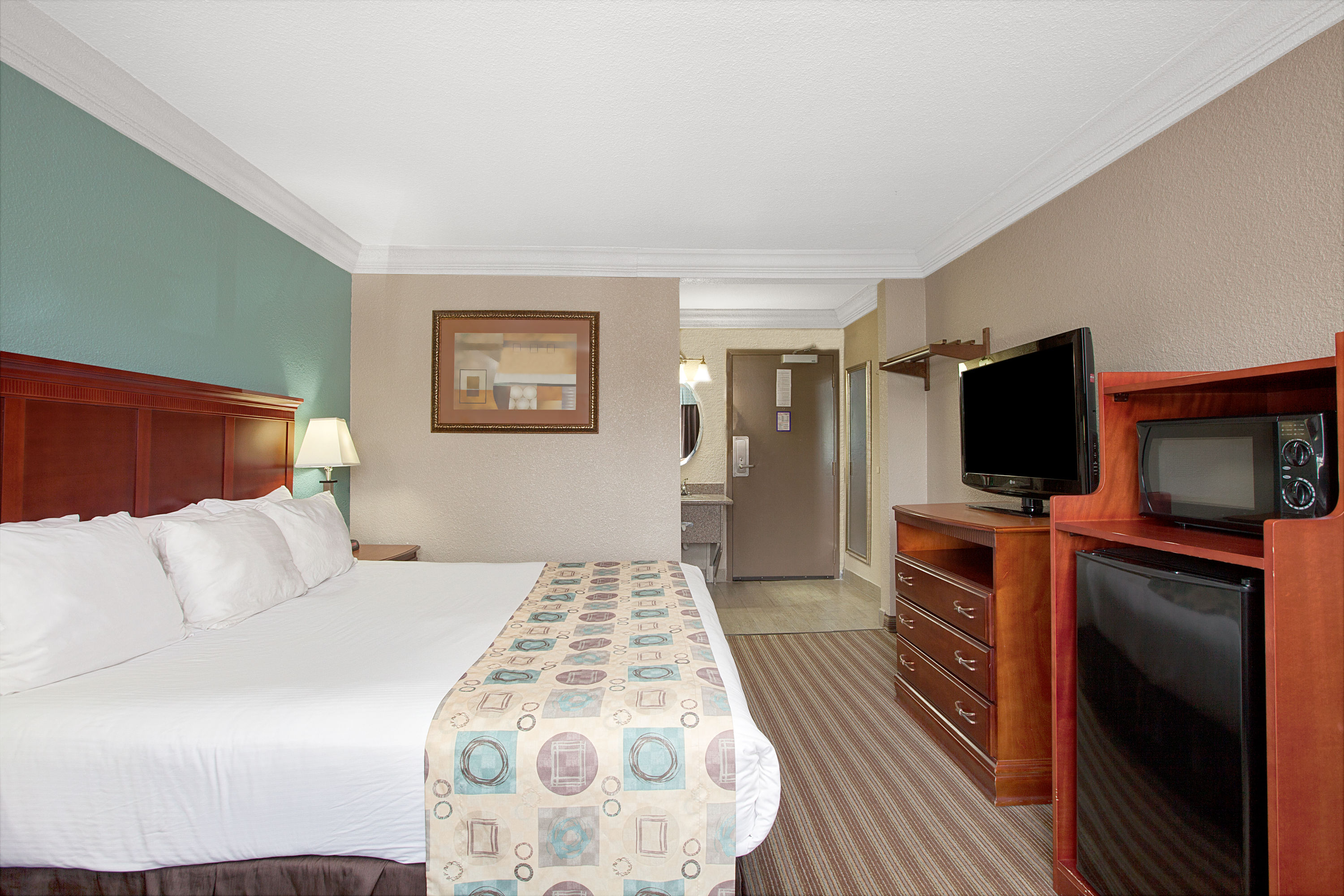 Guest room at the Ramada by Wyndham Houston Intercontinental Airport South in Houston, Texas