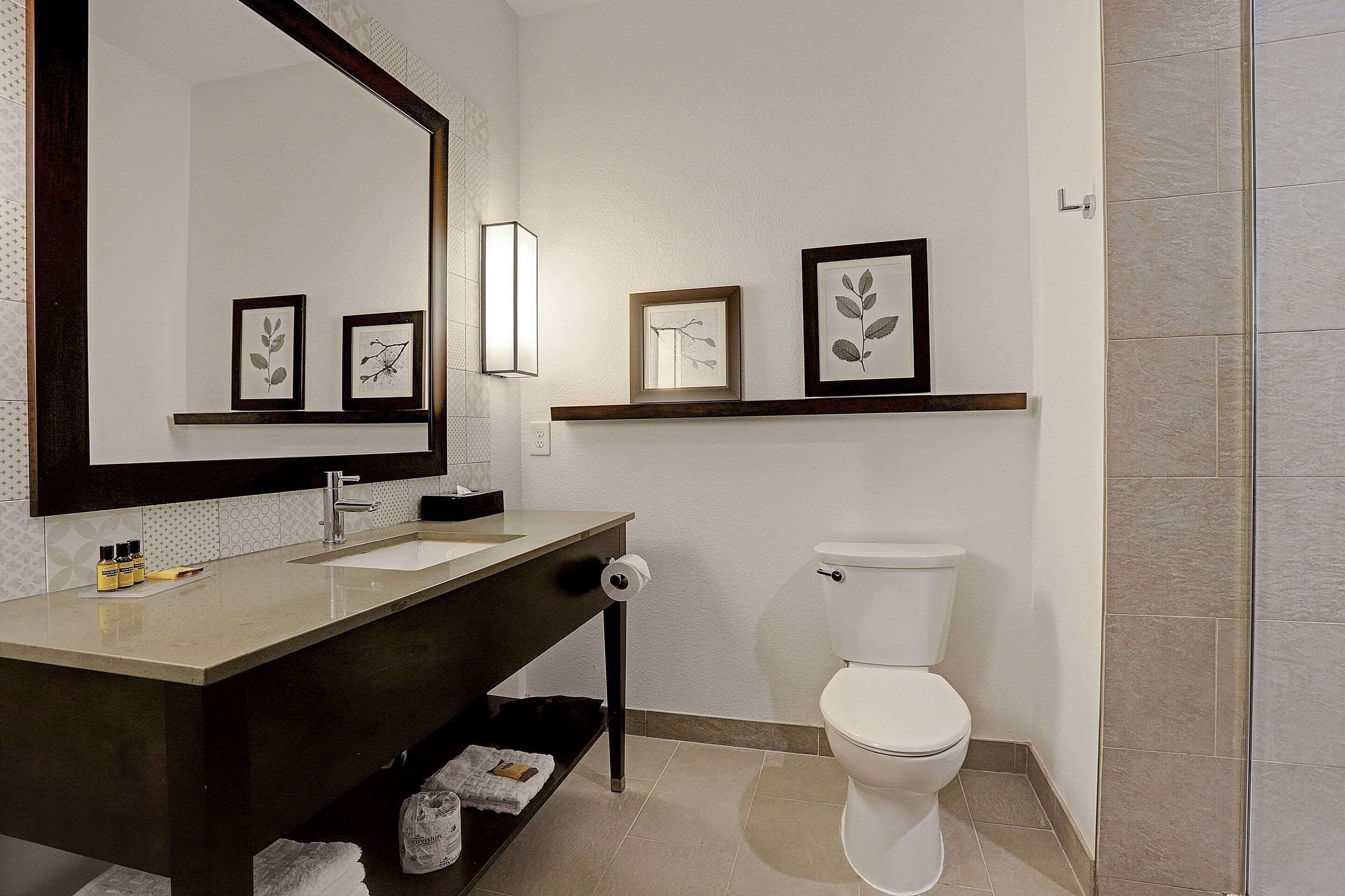Guest room bath at the Ramada by Wyndham Houston Westchase in Houston, Texas