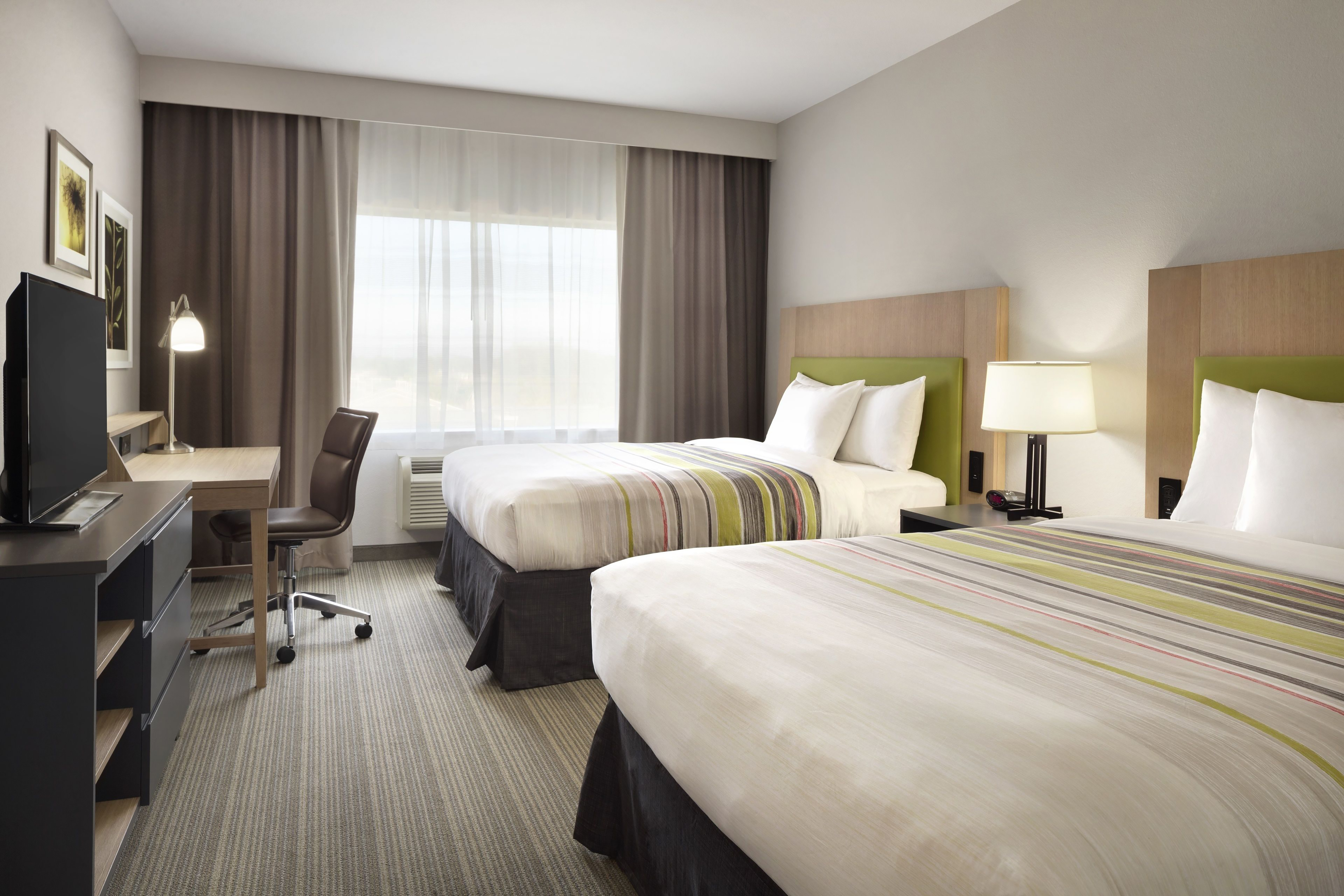 Guest room at the Ramada by Wyndham Houston Westchase in Houston, Texas