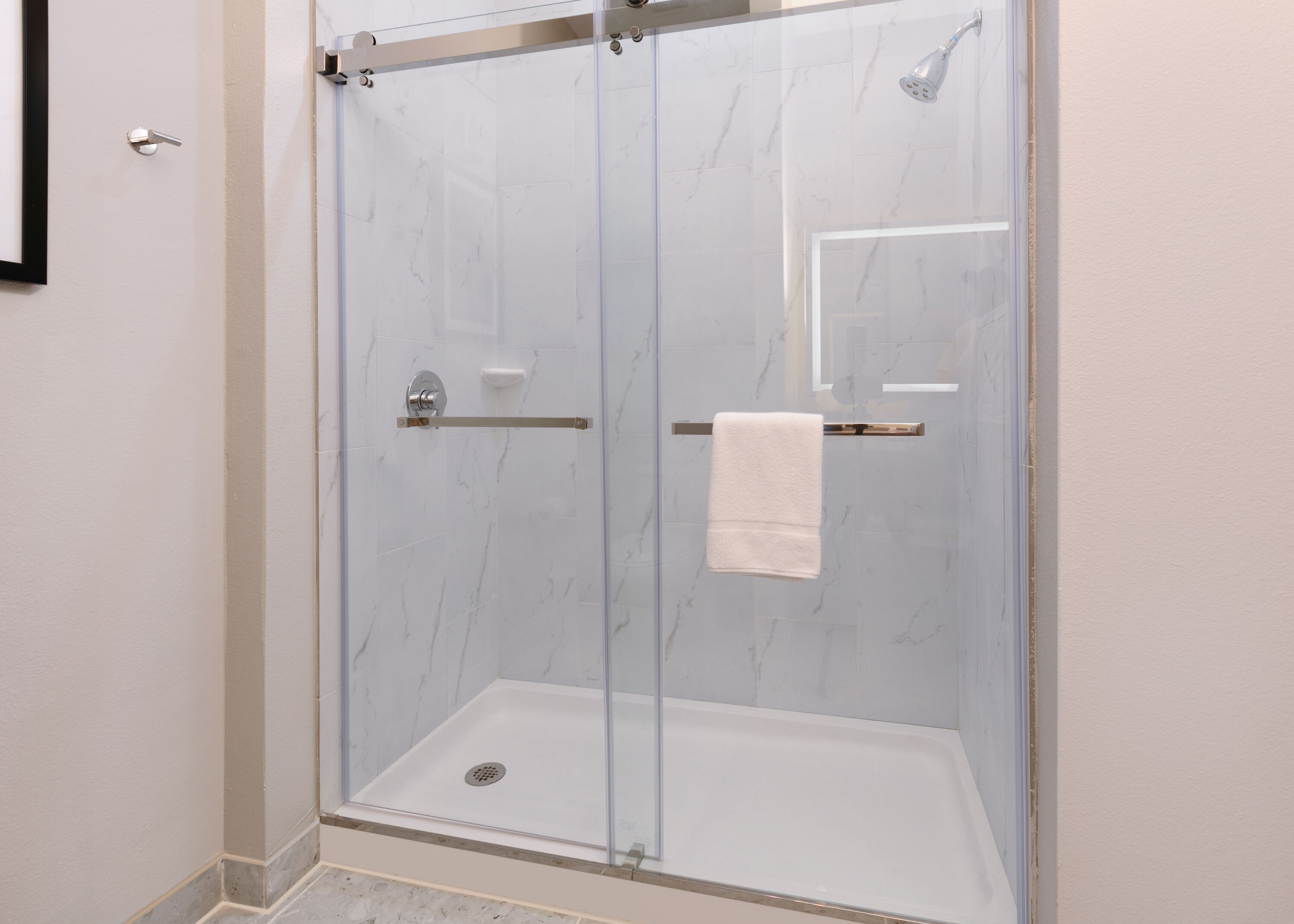 Guest room bath at the The Elm, a Ramada by Wyndham in Little Elm, Texas