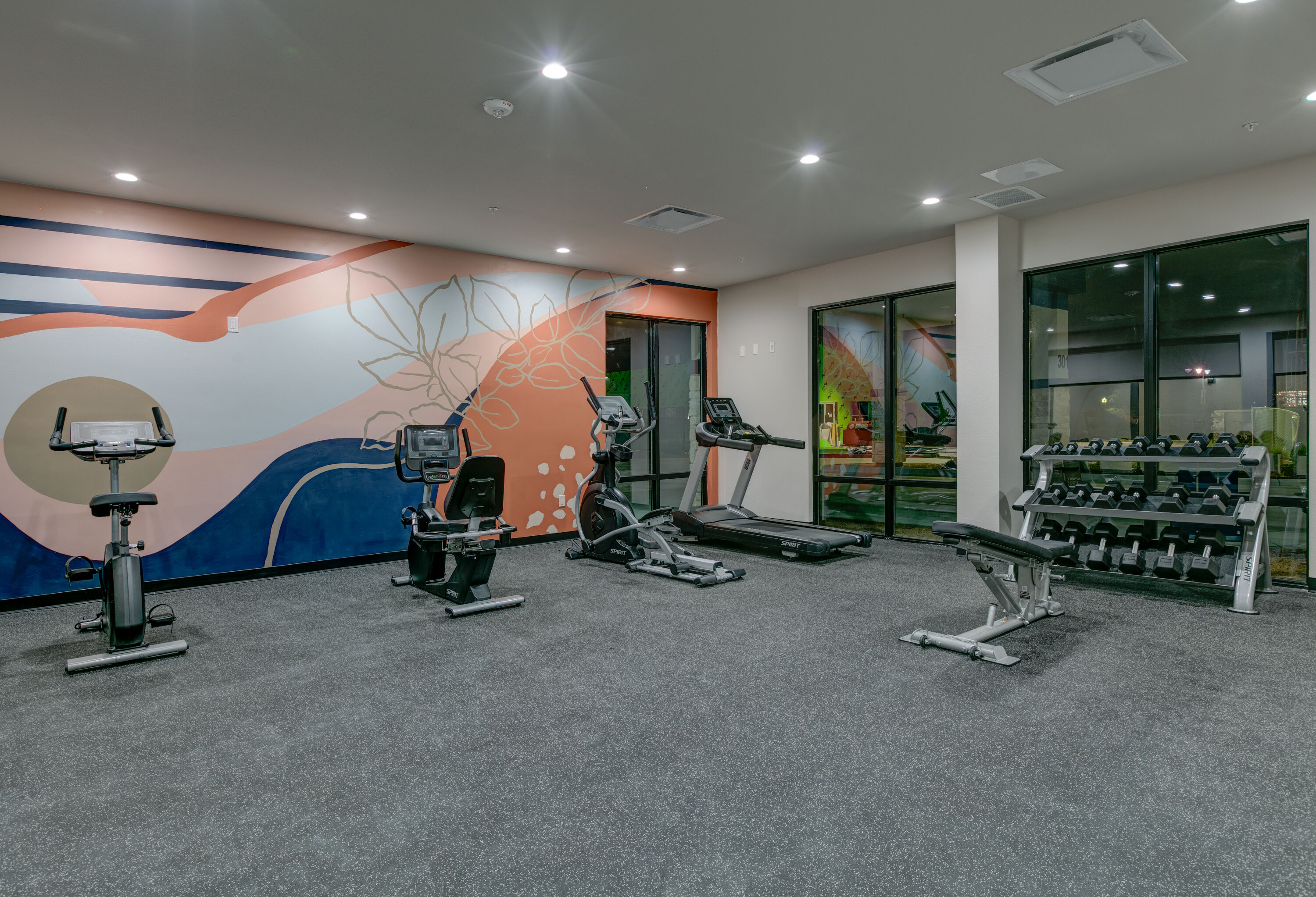 Fitness room at The Elm, a Ramada by Wyndham in Little Elm, Texas