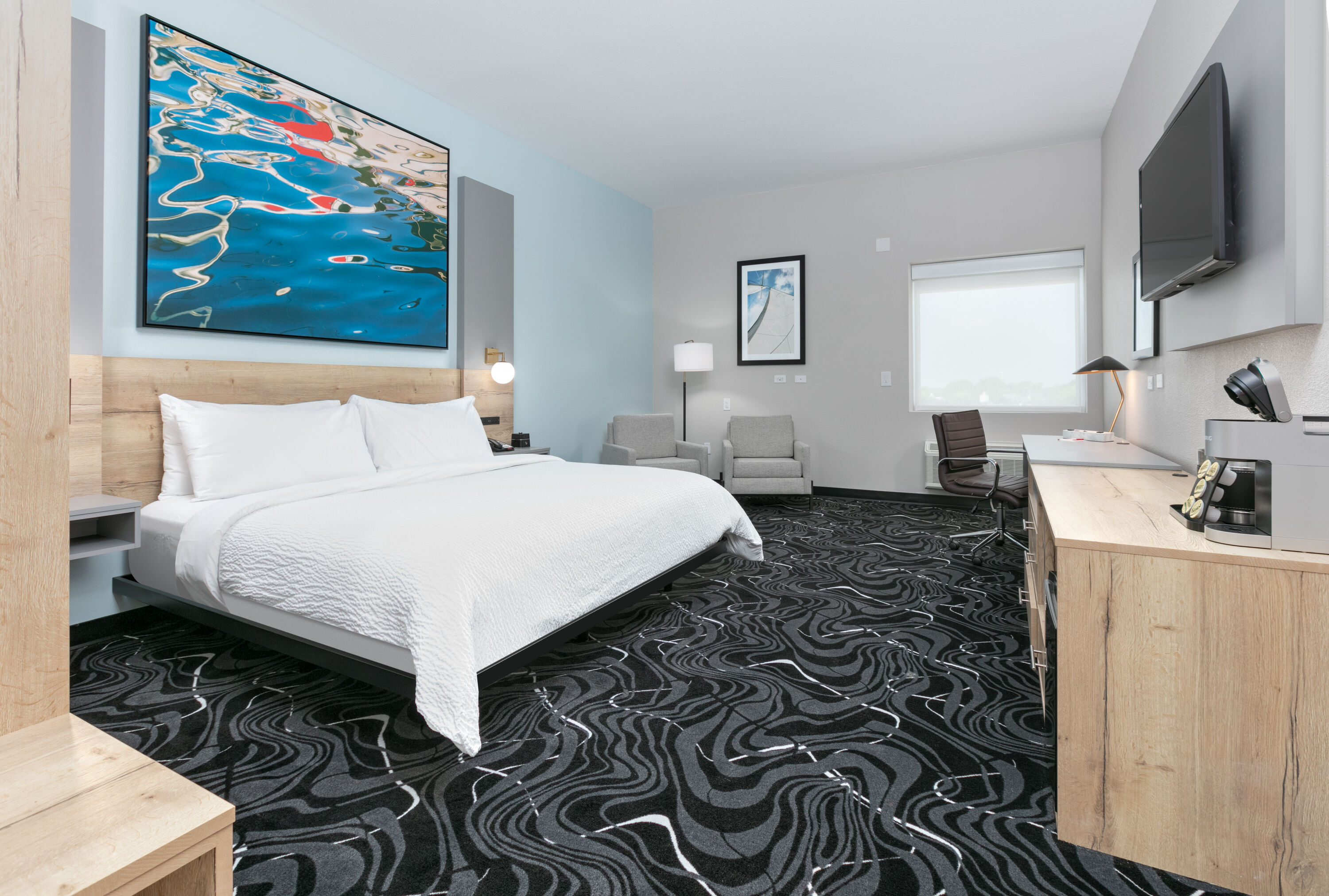 Guest room at the The Elm, a Ramada by Wyndham in Little Elm, Texas