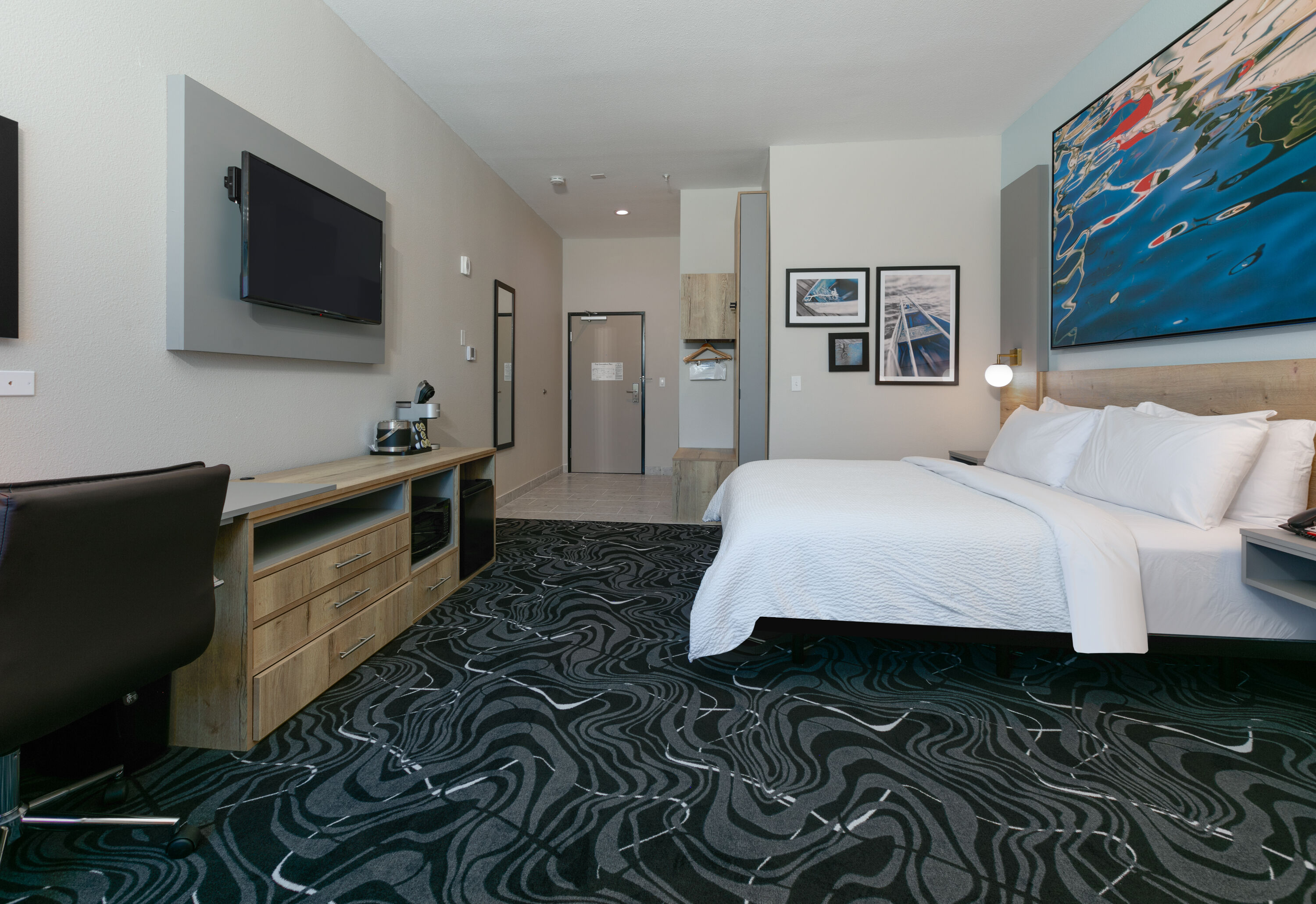 Guest room at the The Elm, a Ramada by Wyndham in Little Elm, Texas