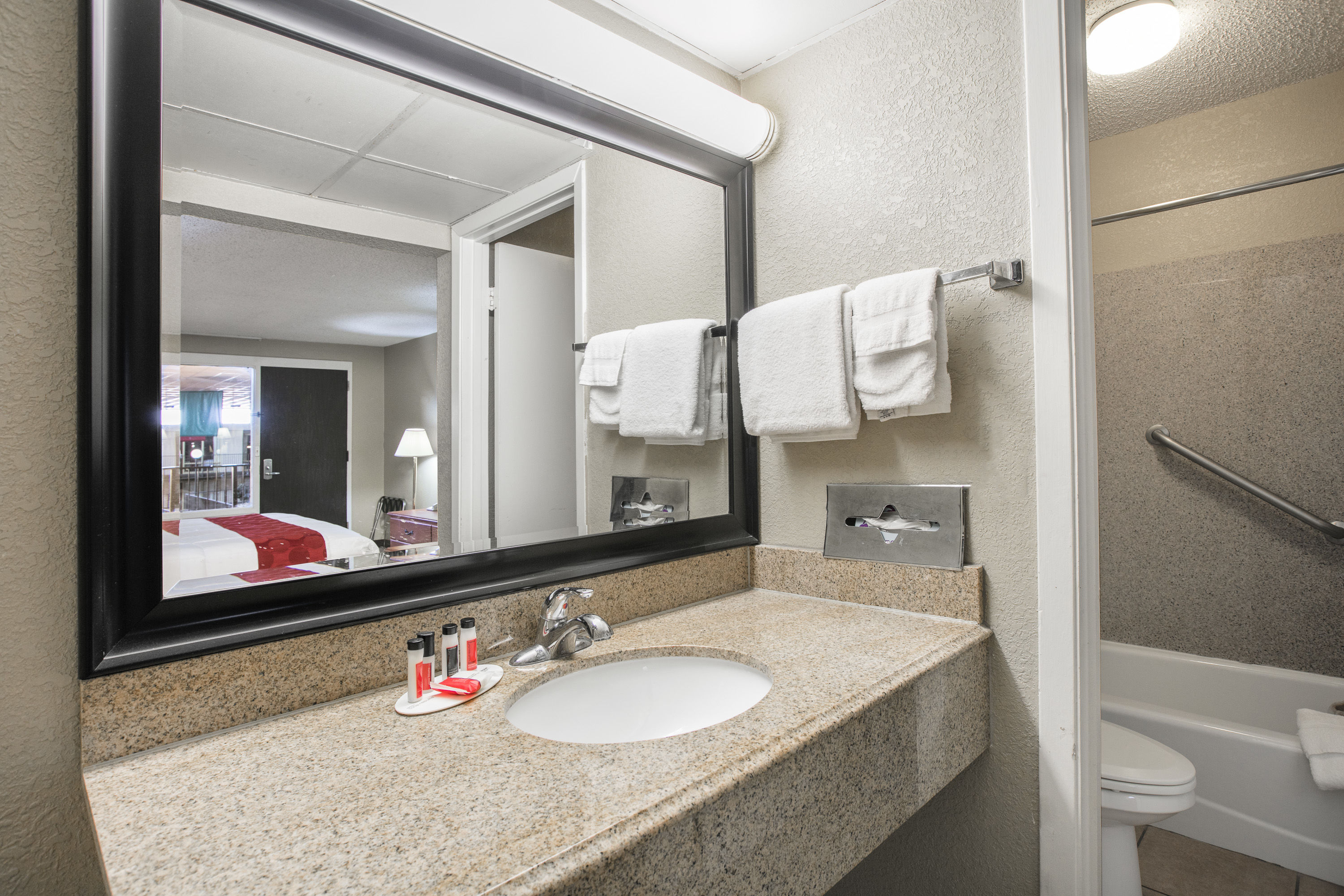 Guest room bath at the Ramada by Wyndham Odessa Near University of Texas Permian in Odessa, Texas