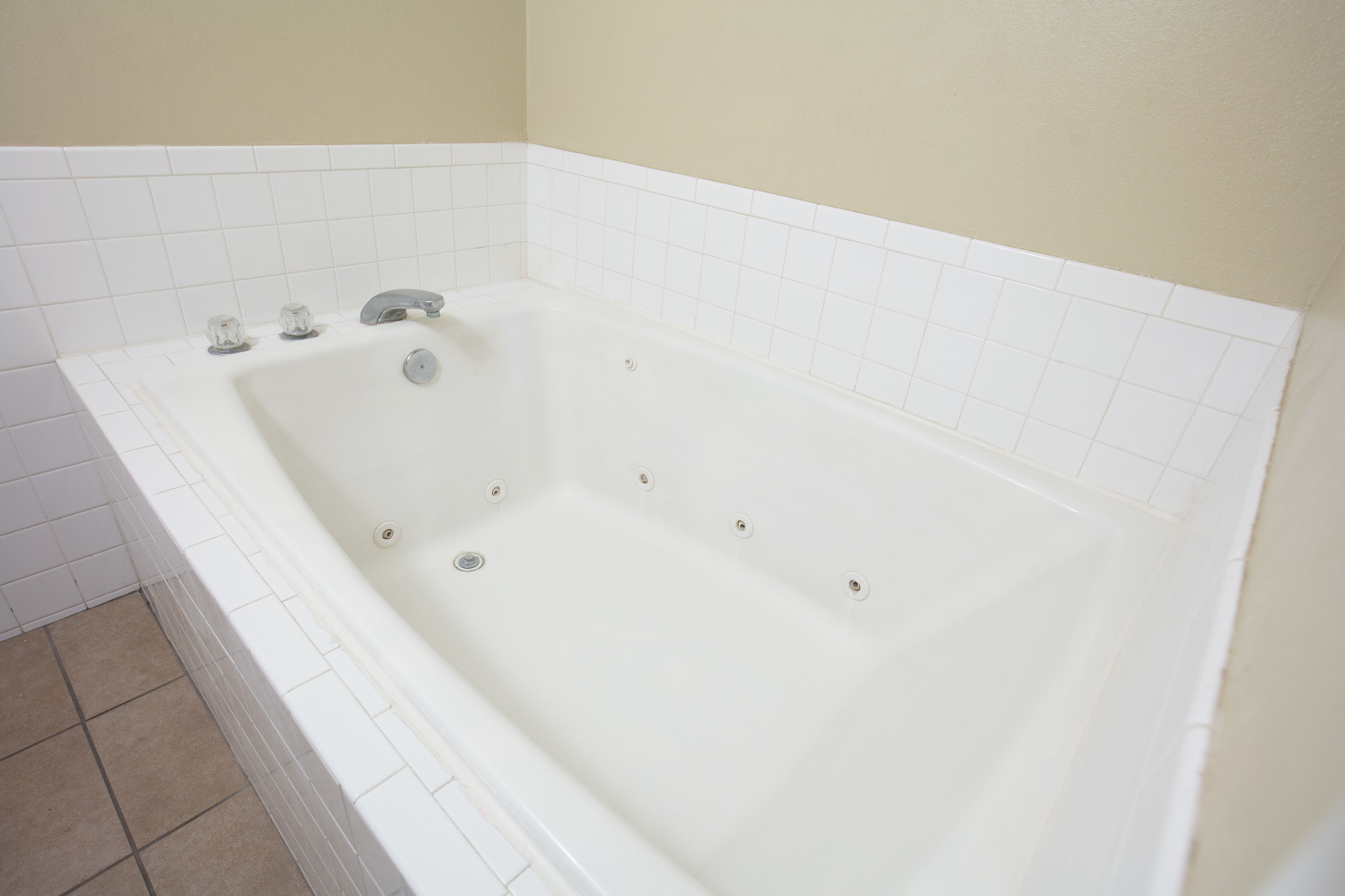 Guest room bath at the Ramada by Wyndham Odessa Near University of Texas Permian in Odessa, Texas