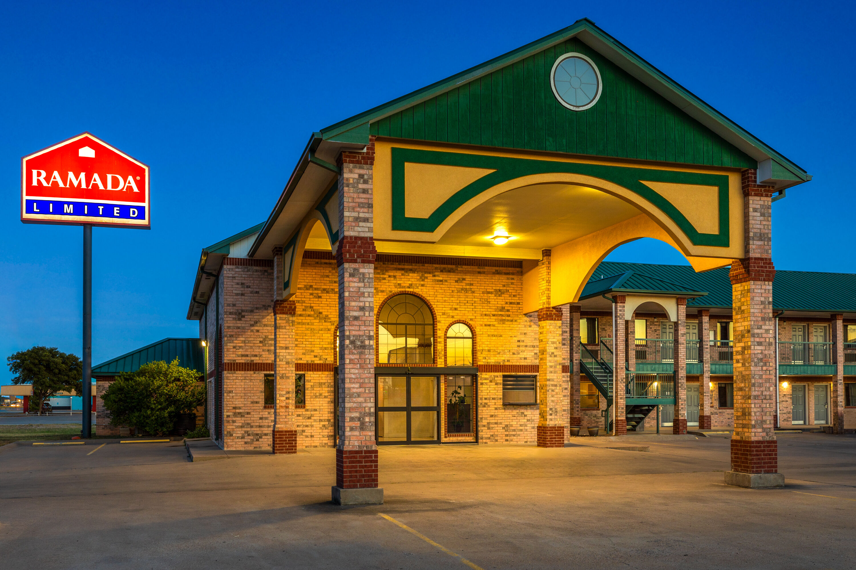 Exterior Dusk Image of Ramada Limited San Angelo hotel in San Angelo, Texas