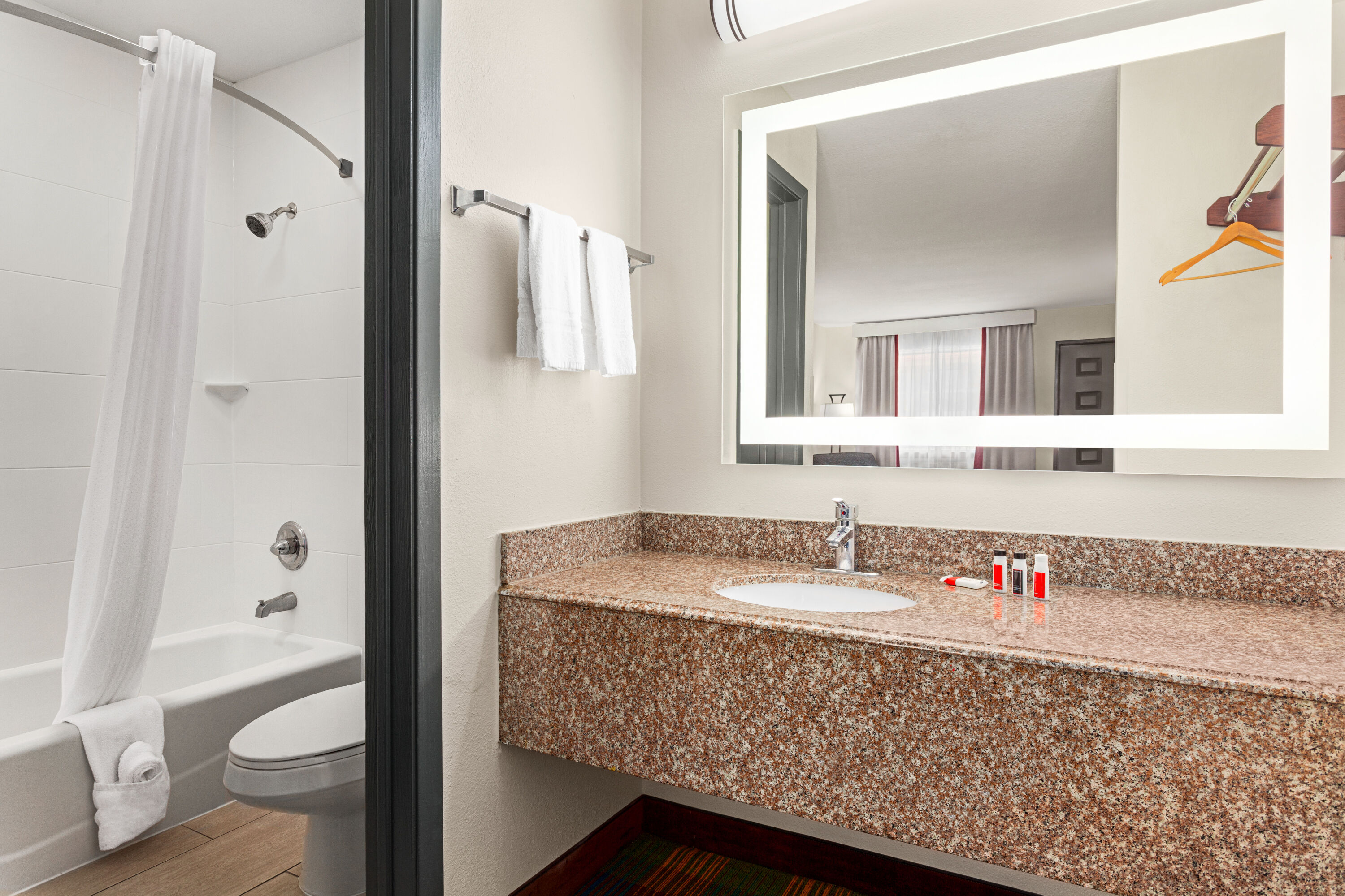 Guest room bath at the Ramada by Wyndham San Antonio Near SeaWorld/Lackland AFB in San Antonio, Texas