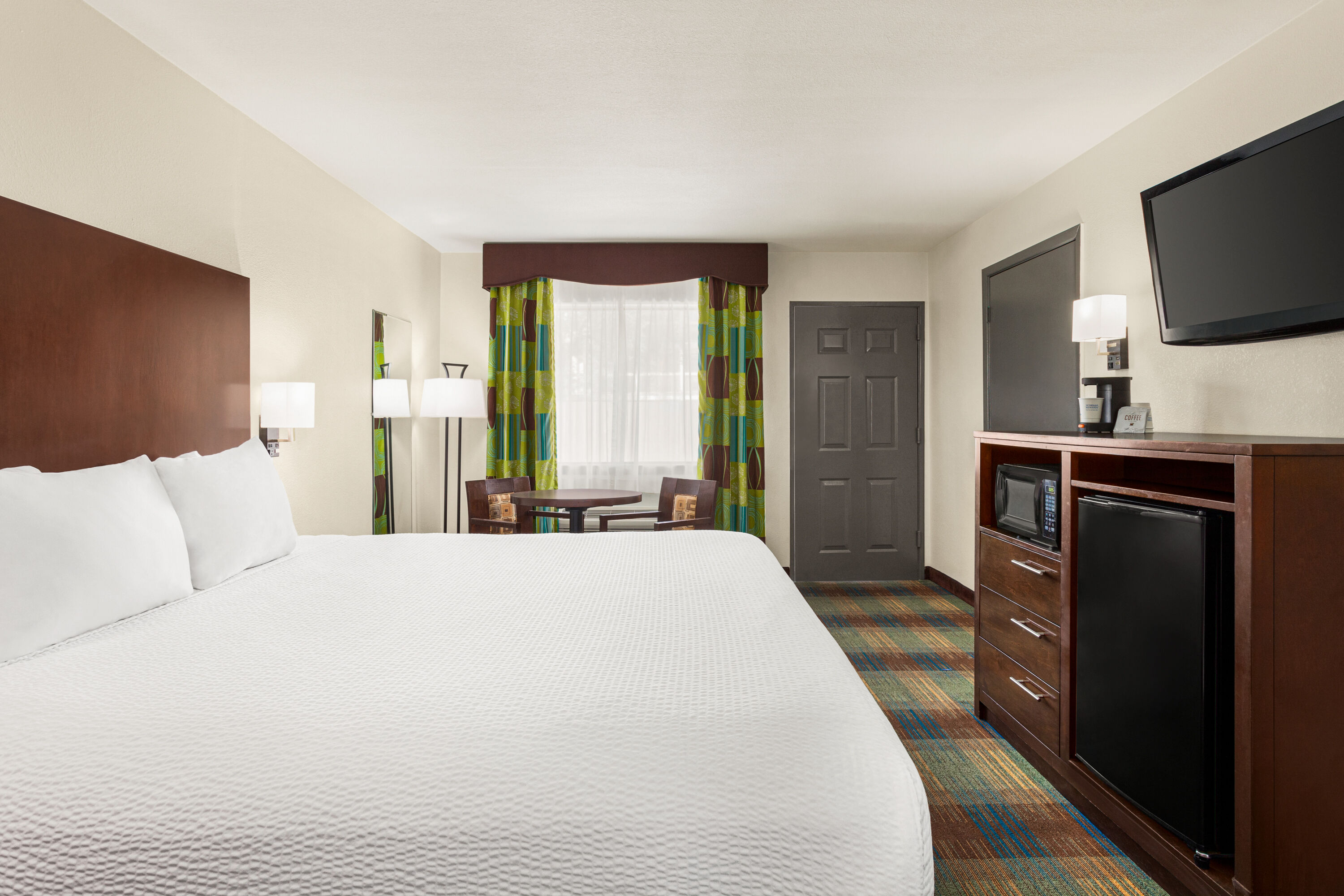 Guest room at the Ramada by Wyndham San Antonio Near SeaWorld/Lackland AFB in San Antonio, Texas