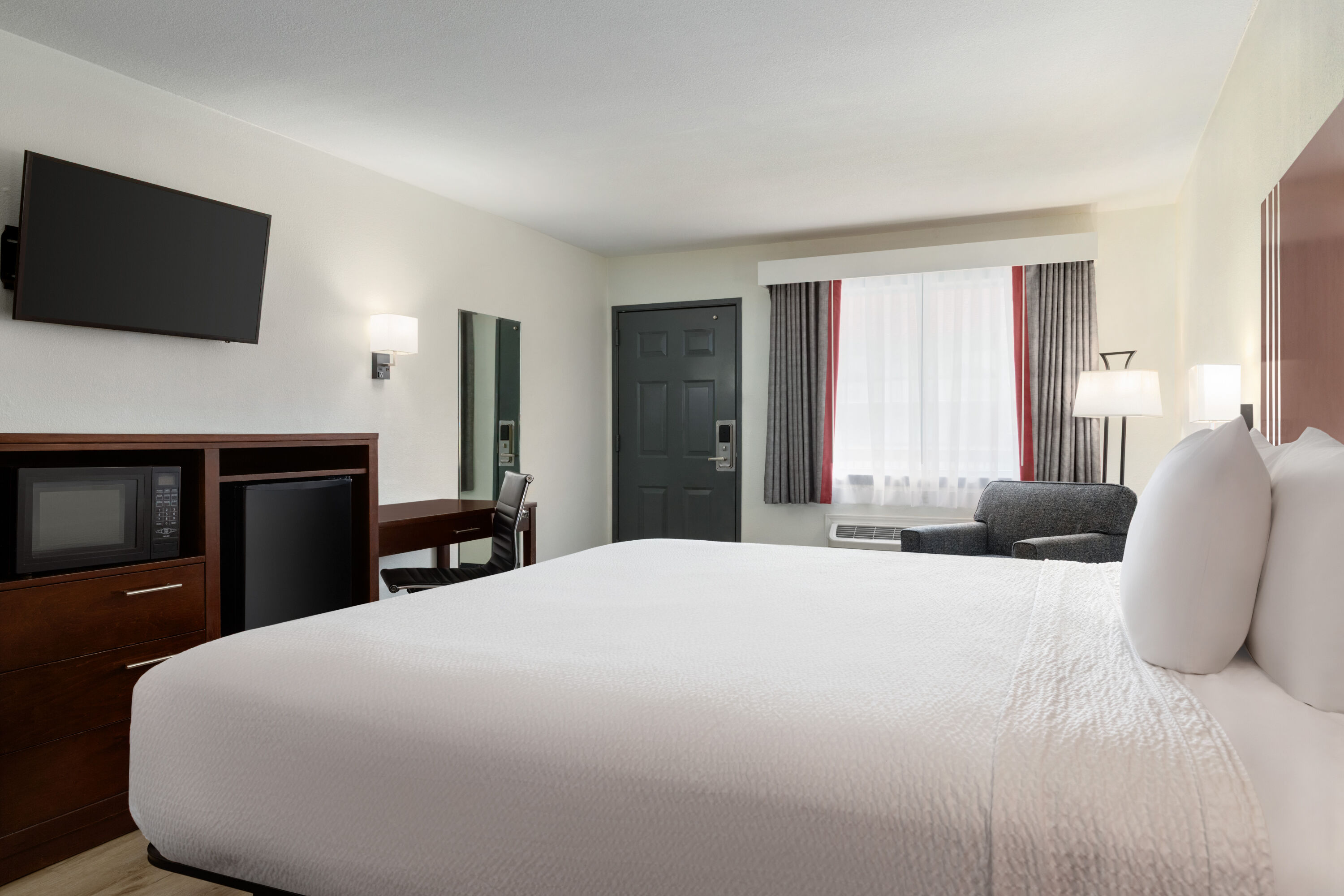 Guest room at the Ramada by Wyndham San Antonio Near SeaWorld/Lackland AFB in San Antonio, Texas