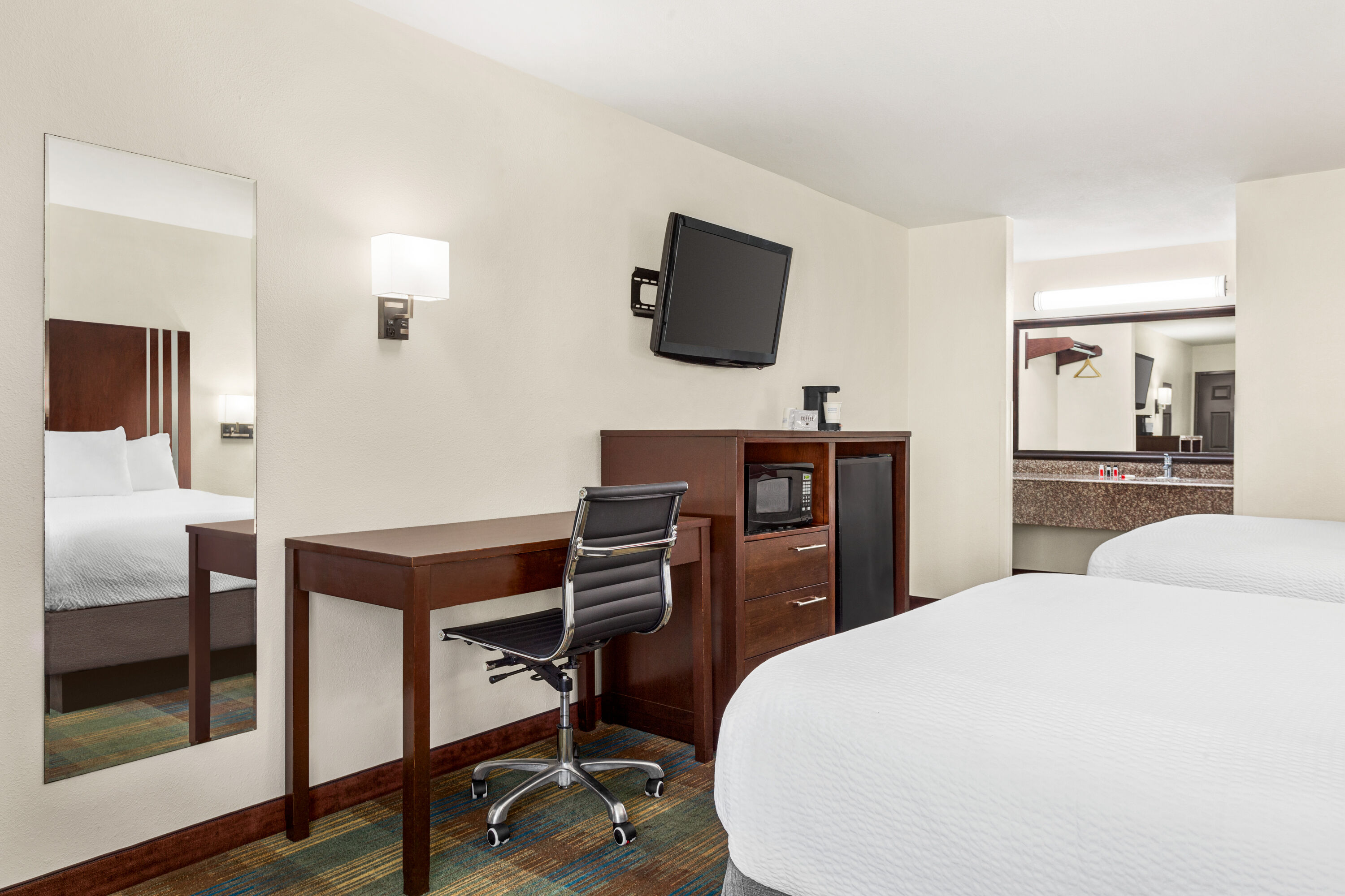 Guest room at the Ramada by Wyndham San Antonio Near SeaWorld/Lackland AFB in San Antonio, Texas