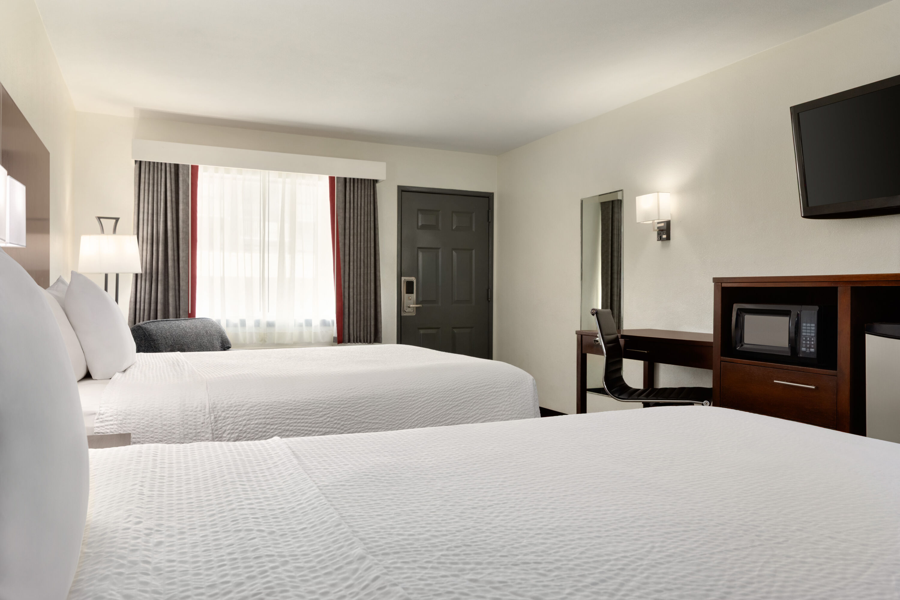 Guest room at the Ramada by Wyndham San Antonio Near SeaWorld/Lackland AFB in San Antonio, Texas