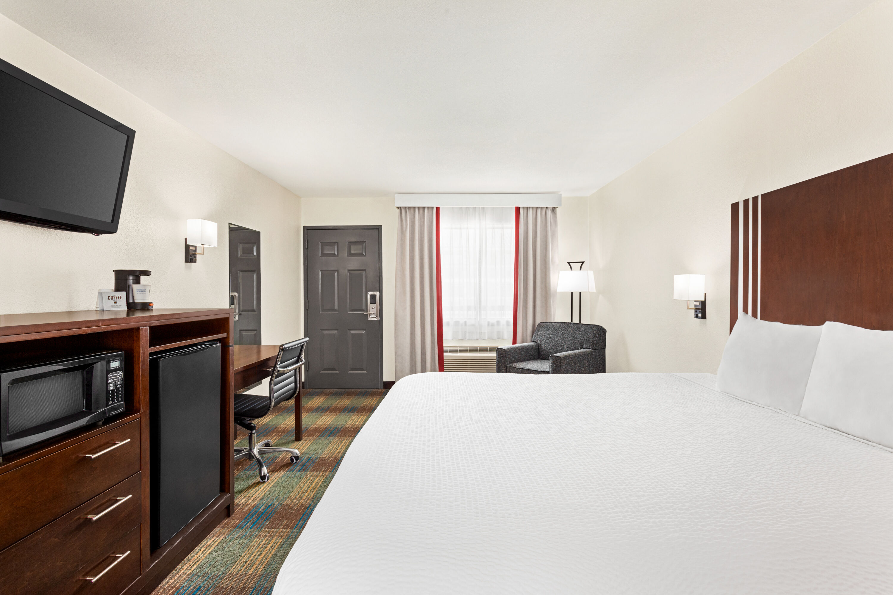 Guest room at the Ramada by Wyndham San Antonio Near SeaWorld/Lackland AFB in San Antonio, Texas