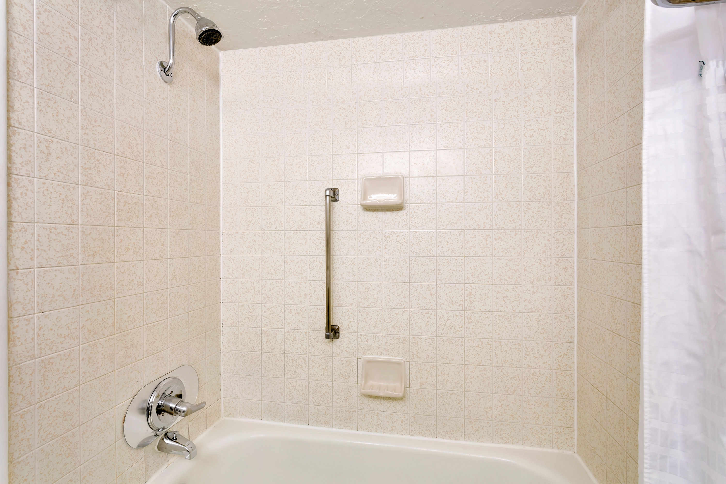 Guest room bath at the Ramada by Wyndham Provo in Provo, Utah
