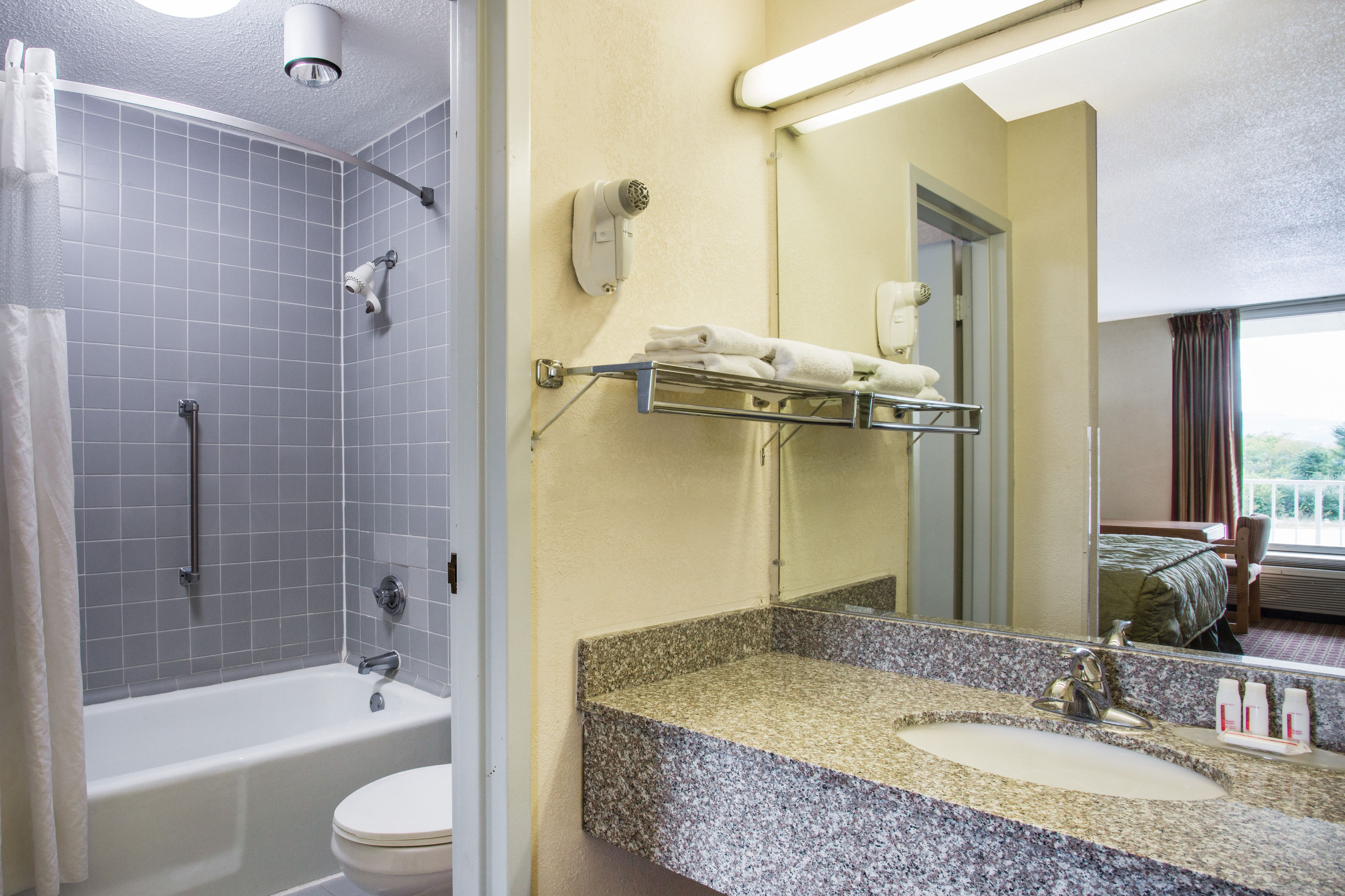 Guest room bath at the Ramada by Wyndham Wytheville in Wytheville, Virginia