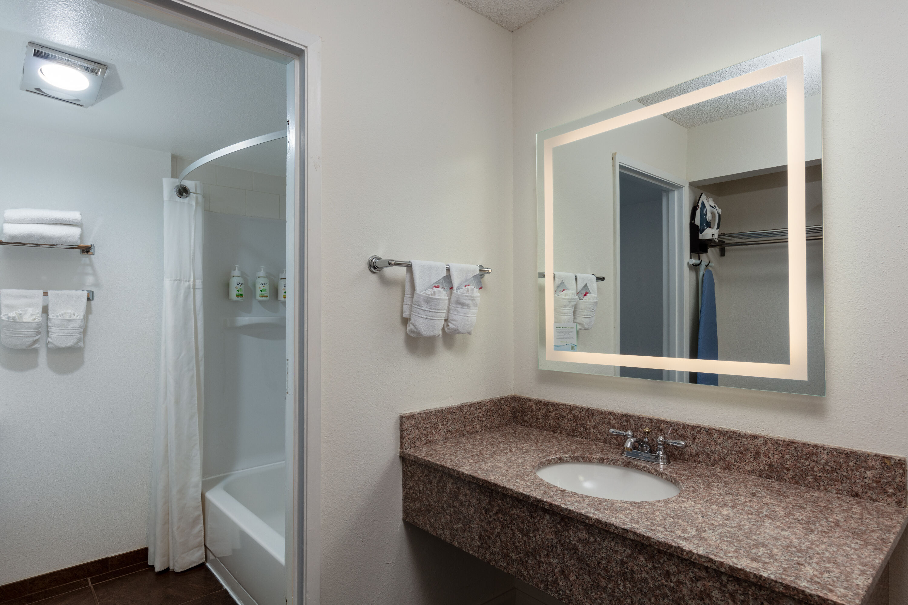 Guest room bath at the Ramada by Wyndham Spokane Airport in Spokane, Washington