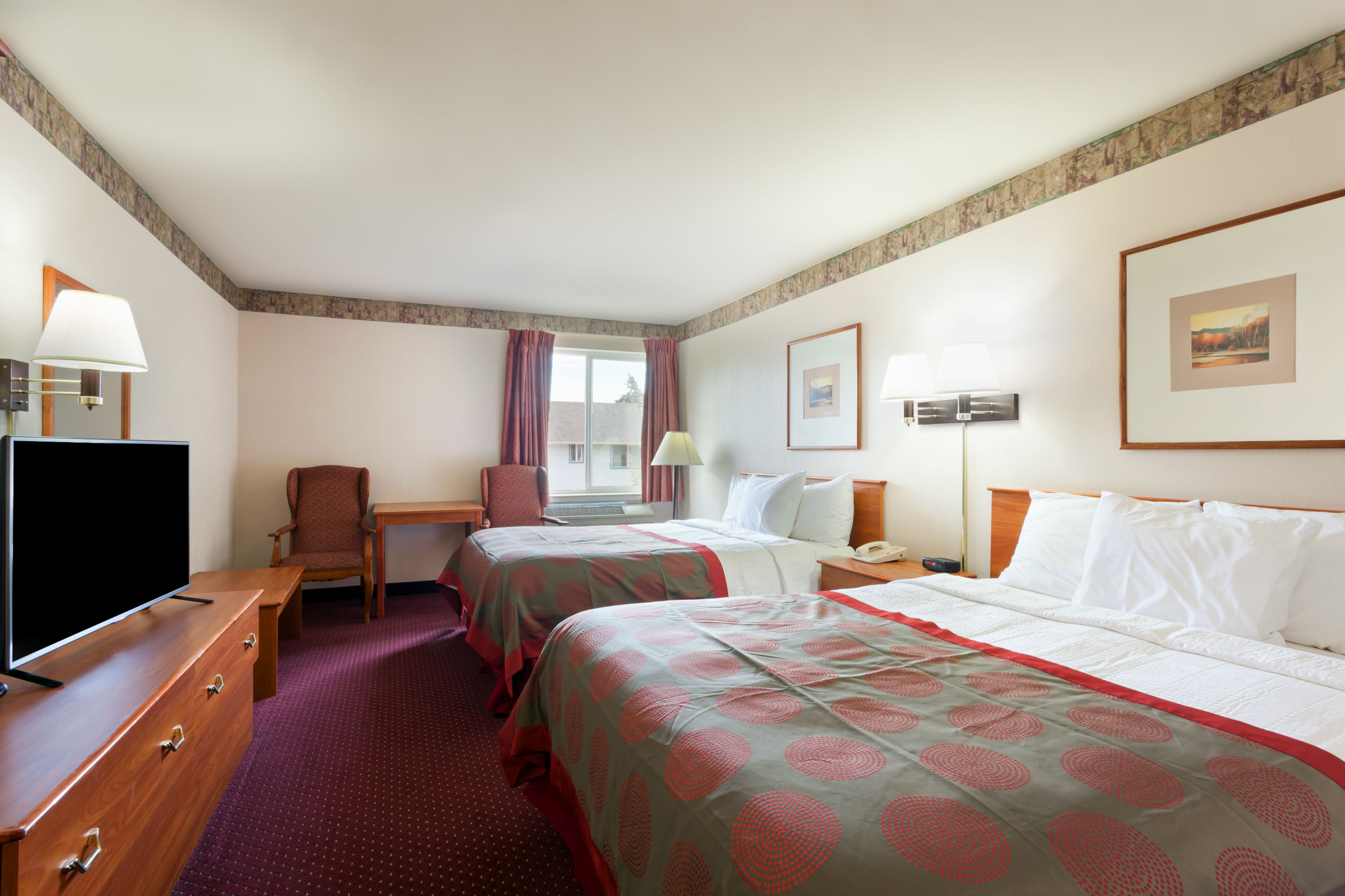 Guest room at the Ramada by Wyndham SeaTac Airport North in Tukwila, Washington